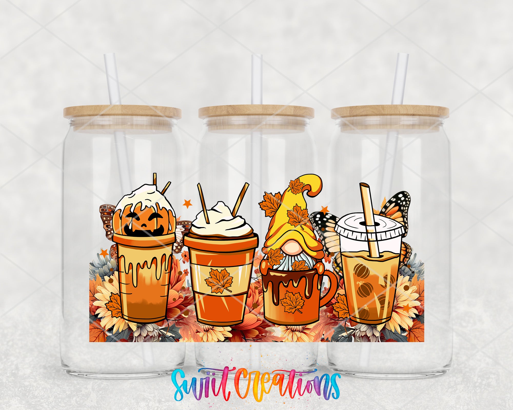A collection of three glass jars with straws, each containing a different beverage and decorated with autumn-themed elements such as leaves, pumpkins, and butterflies.