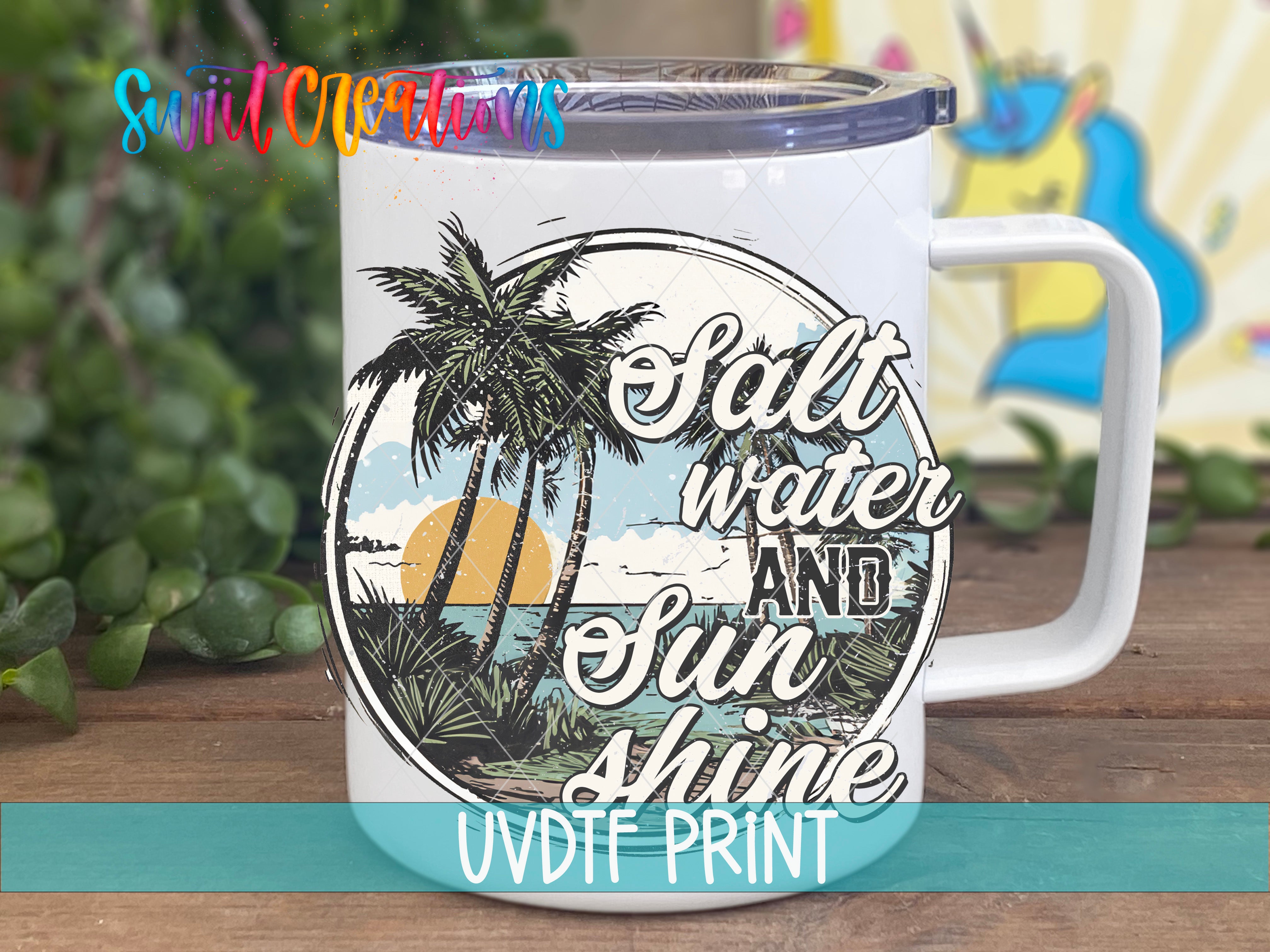 a white coffee mug with palm trees and the words salt water and sun shine under