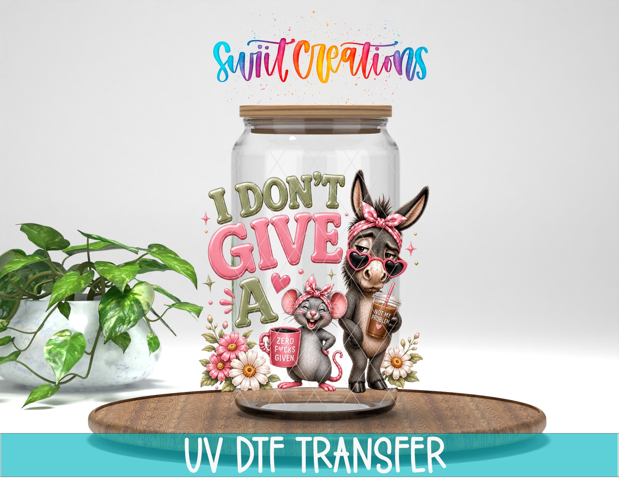 a jar with a donkey and a mouse inside, along with a colorful and whimsical design. The jar is placed on a wooden surface, and there is a potted plant in the background. The image also includes text that says "I DON'T GIVE A" and "UV DFT TRANSFER".