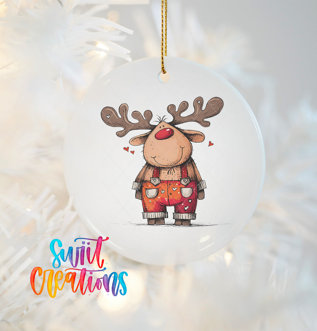 A white ornament featuring a cartoon reindeer with antlers and a red nose, wearing overalls and surrounded by hearts.