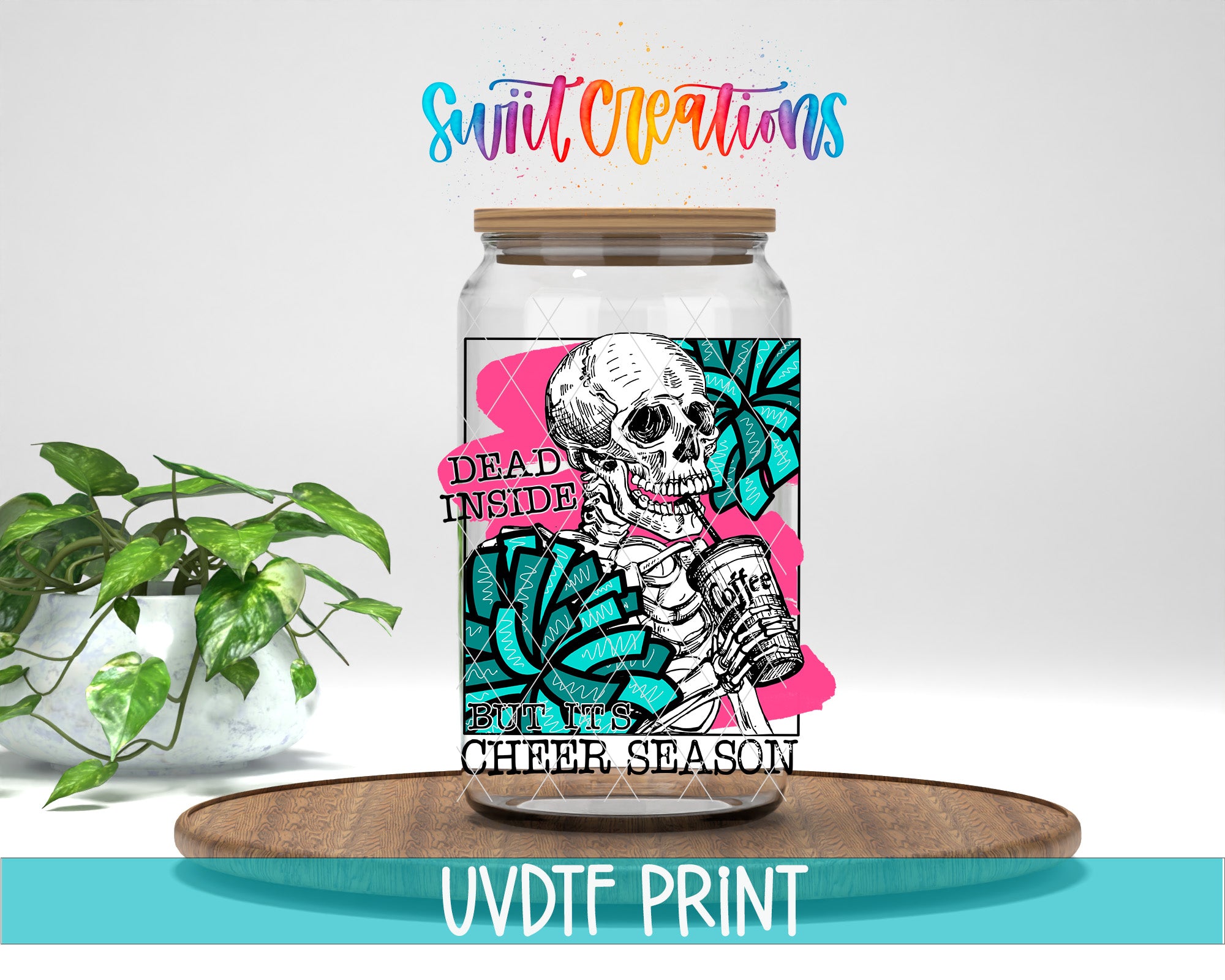 a jar with a skeleton on it sitting next to a potted plant