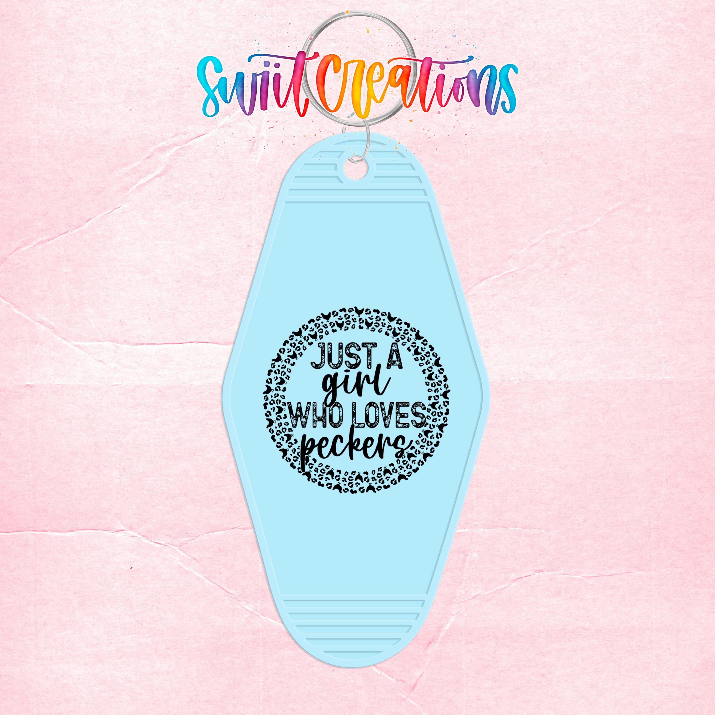 A light blue keychain with a black text design that says "Just a girl who loves peckerel".