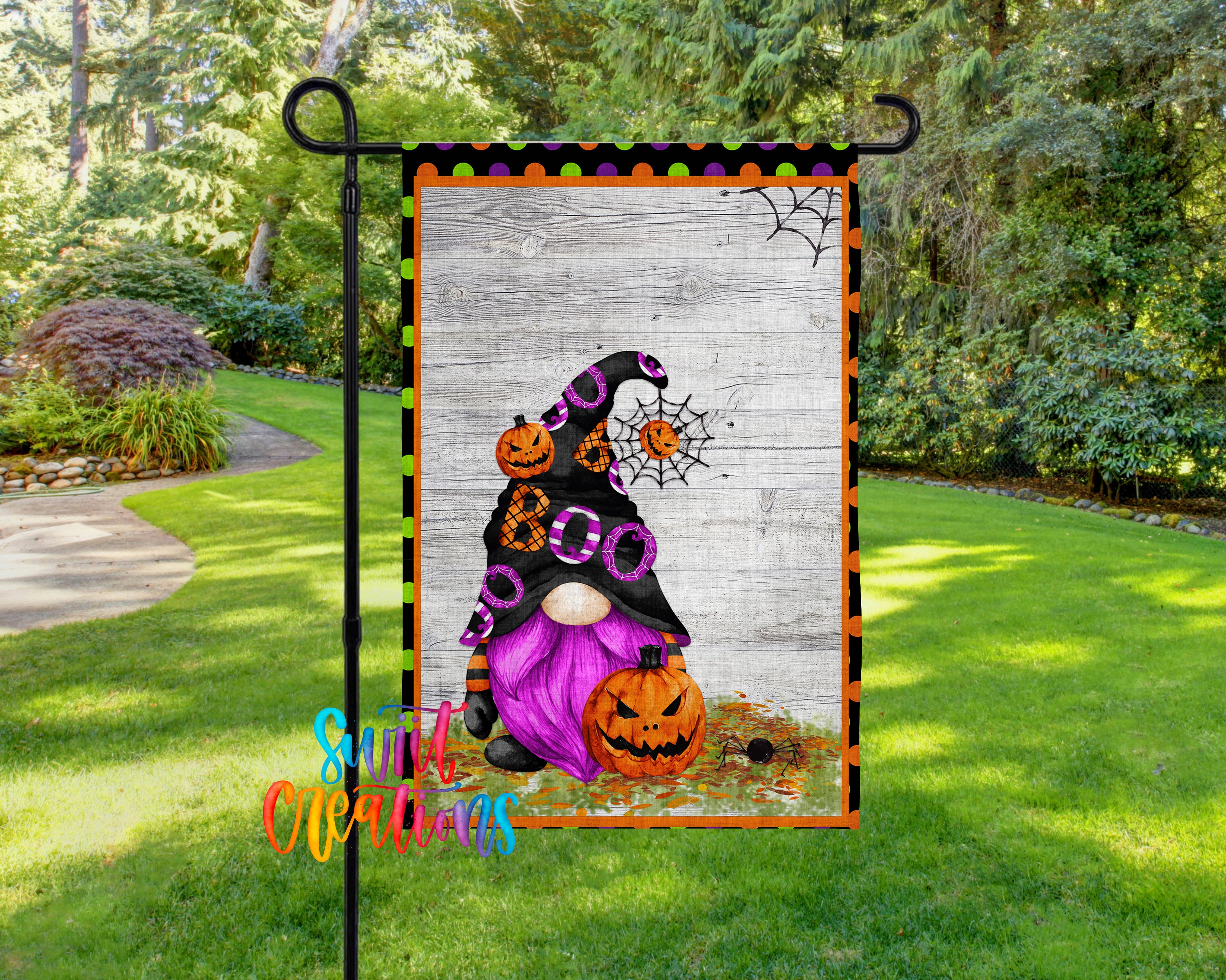 A Halloween-themed garden flag featuring a purple gnome holding a jack-o-lantern and a spider web design.
