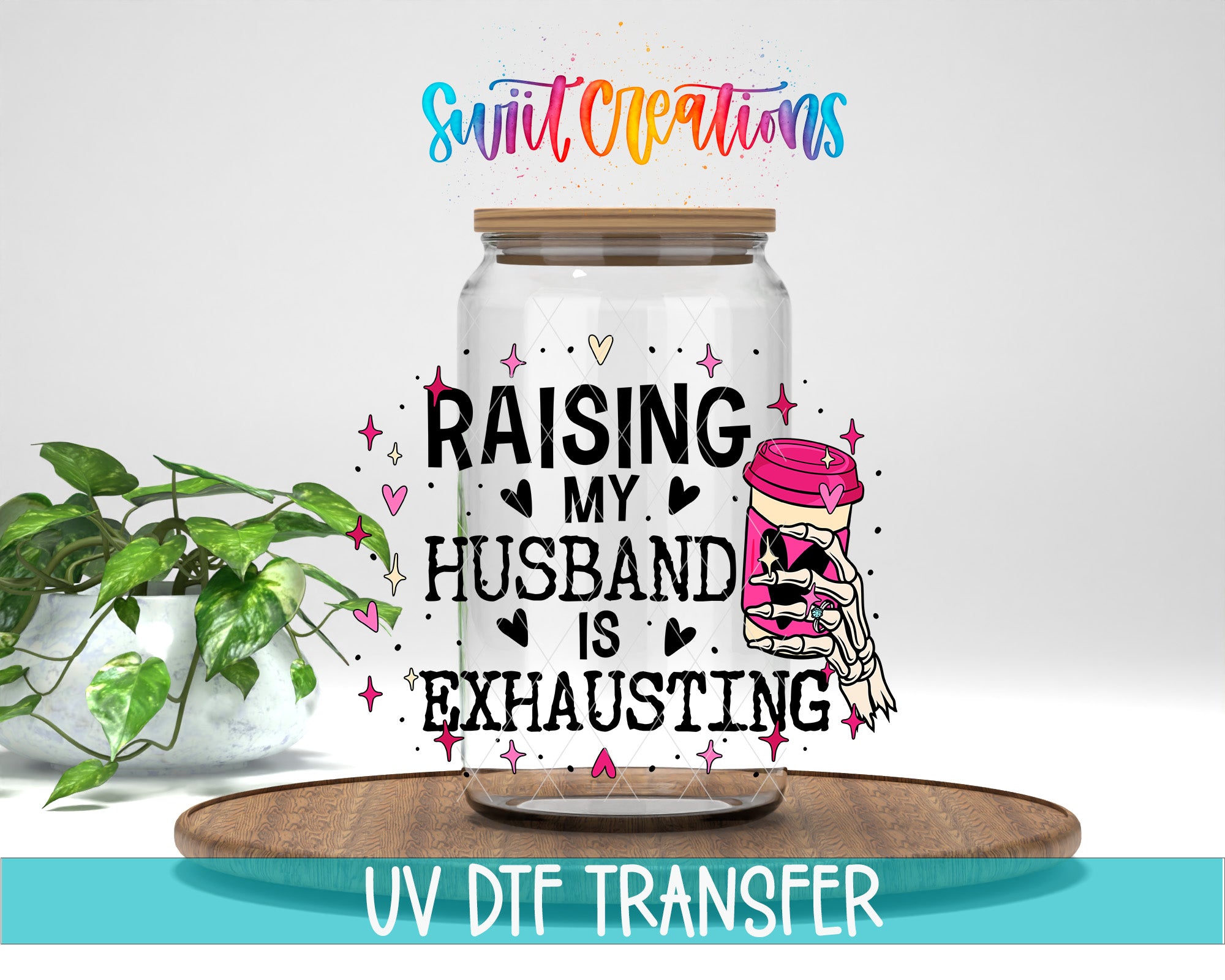 a glass jar with a label that reads "Raising My Husband Is Exhausting" and a skeleton hand holding a jar. The jar is placed on a wooden surface, and there is a potted plant in the background.