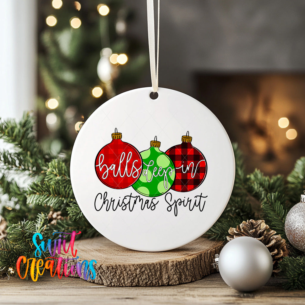 A white Christmas ornament with the text "balls keep in Christmas spirit" and three Christmas ornaments in red, green, and red plaid colors, hanging on a string.