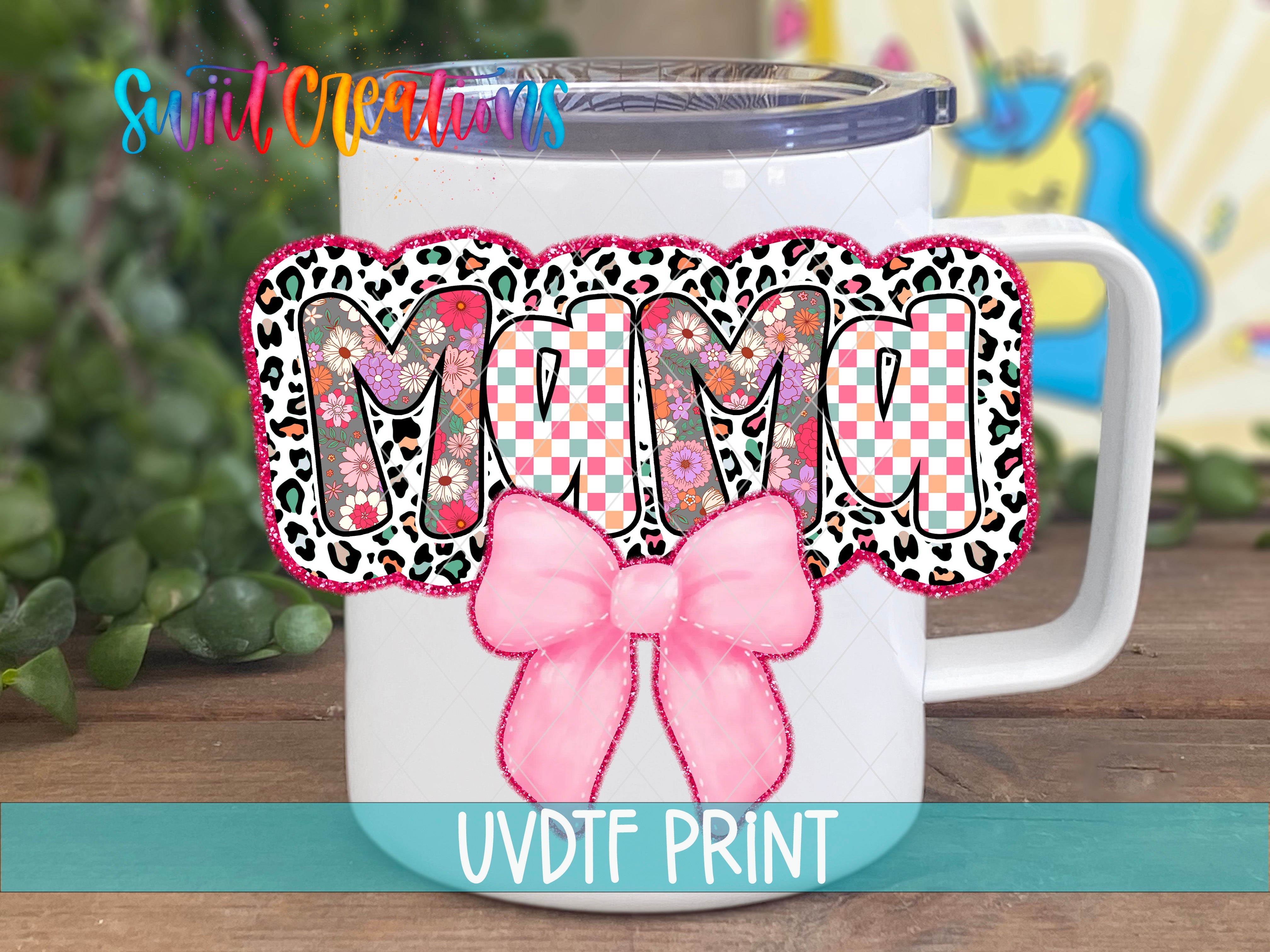 a white coffee mug with a pink bow on it
