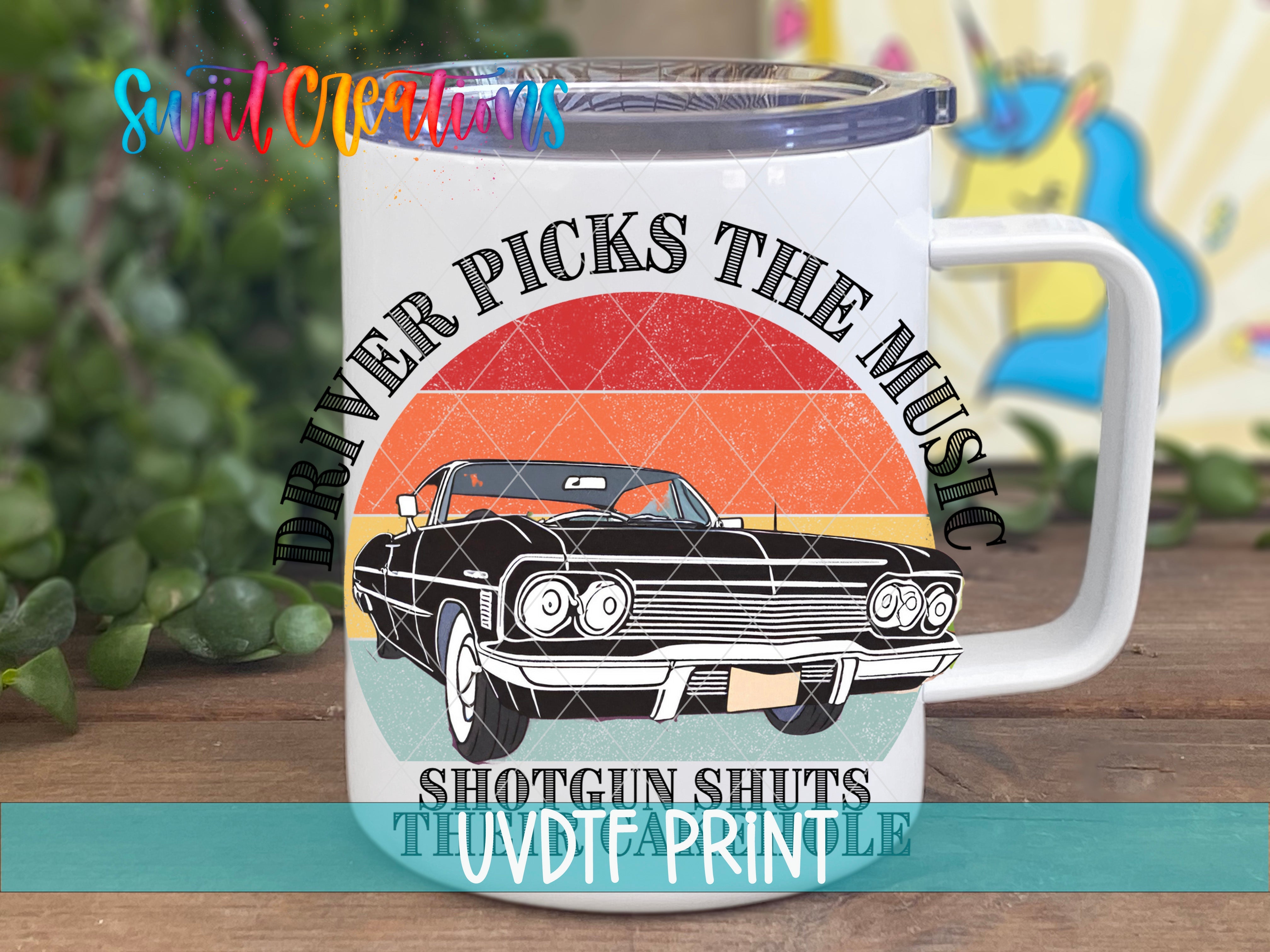 a white coffee mug with a black car on it