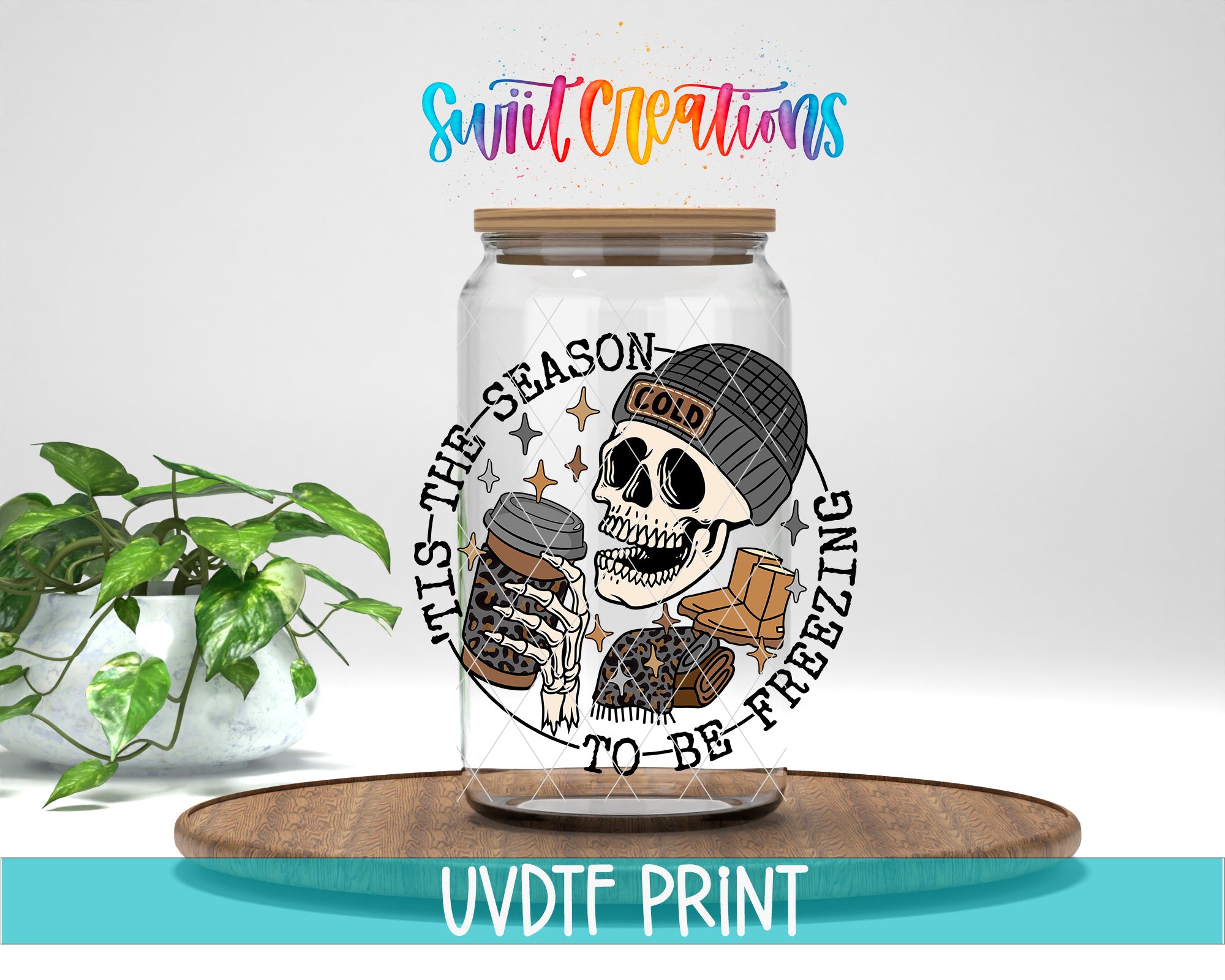 a glass jar with a skull and coffee cup design, placed on a wooden surface.