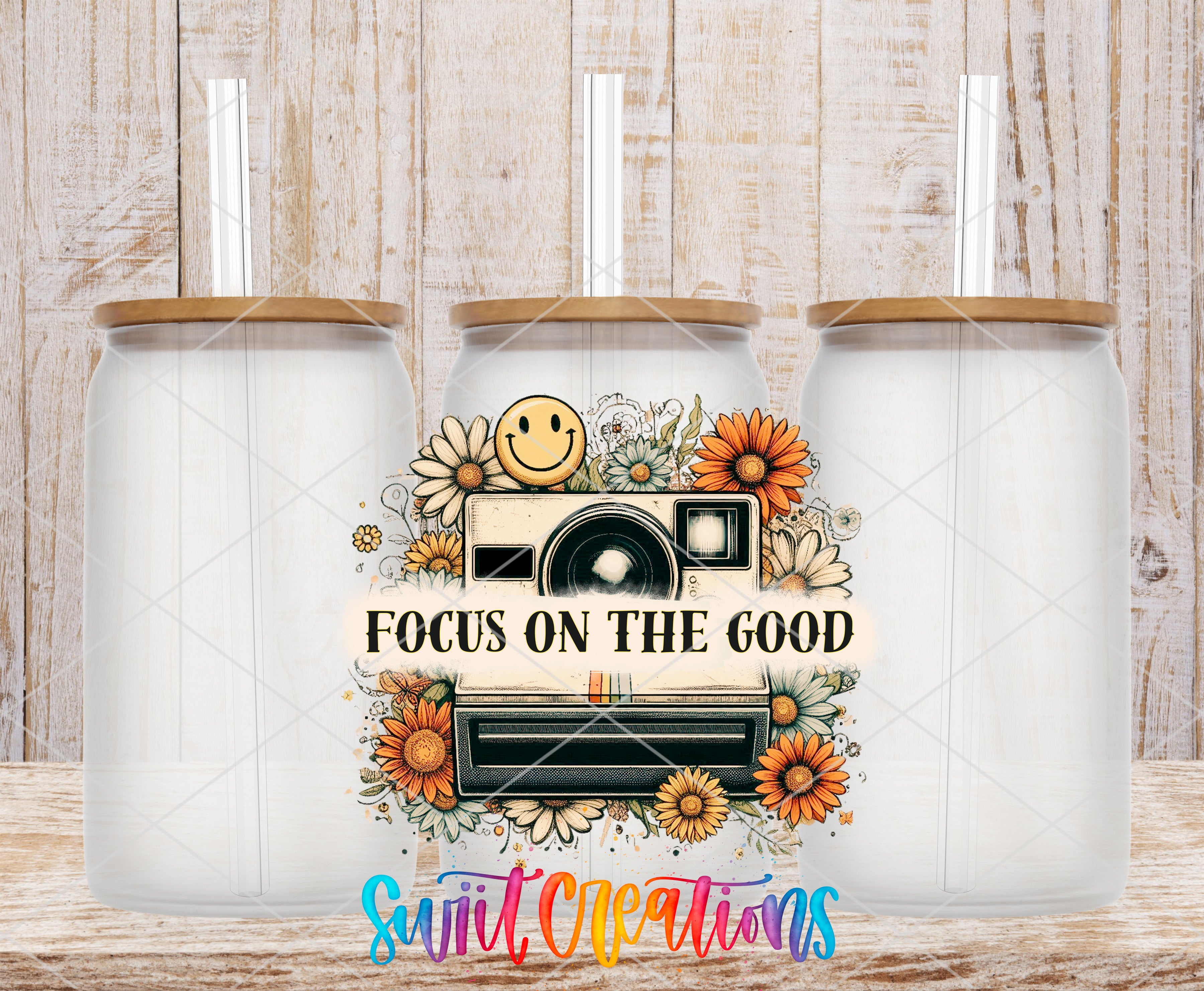 Swiit Creations UV DTF Focus on The Good transfer shown on a clear glass can set