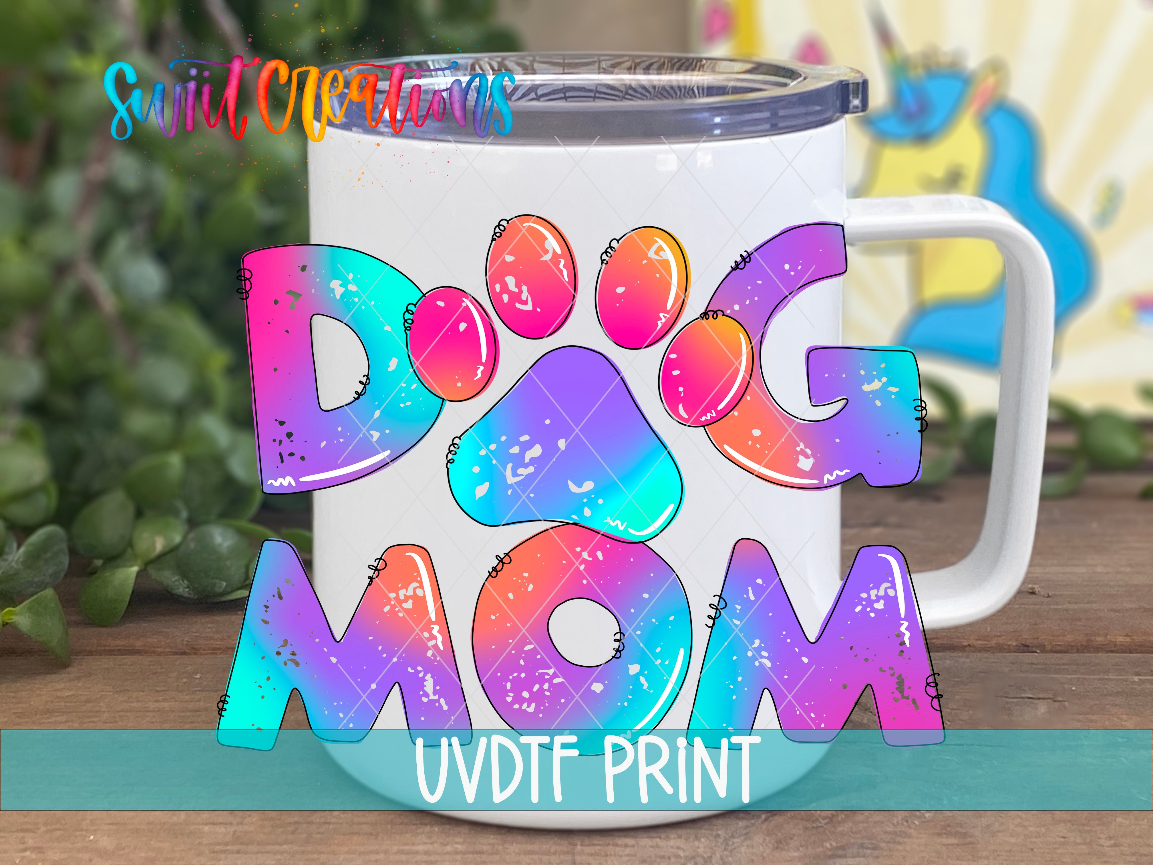 a coffee mug with the words dog mom painted on it