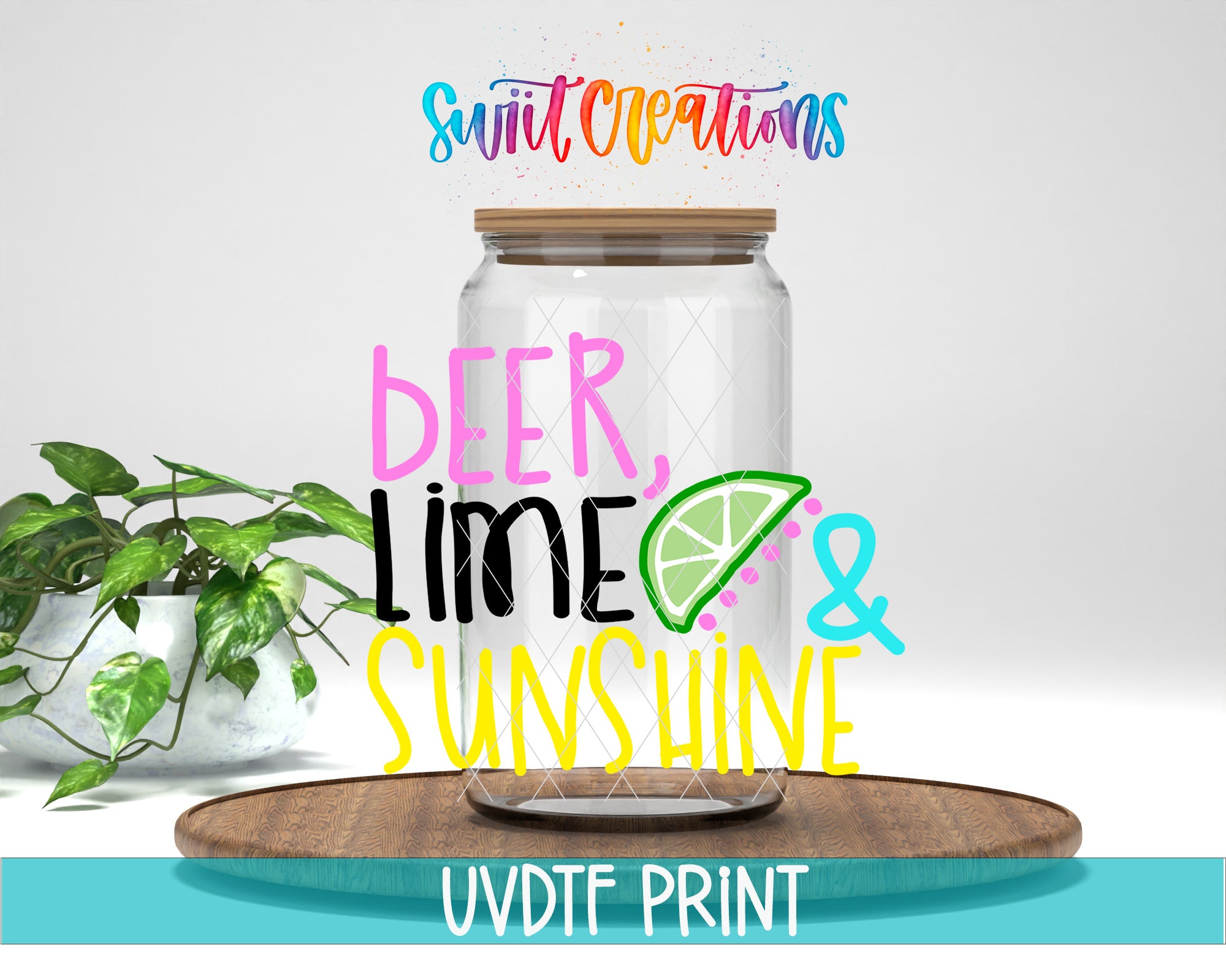 a clear glass jar with colorful text and a lime slice decoration, placed on a wooden tray.