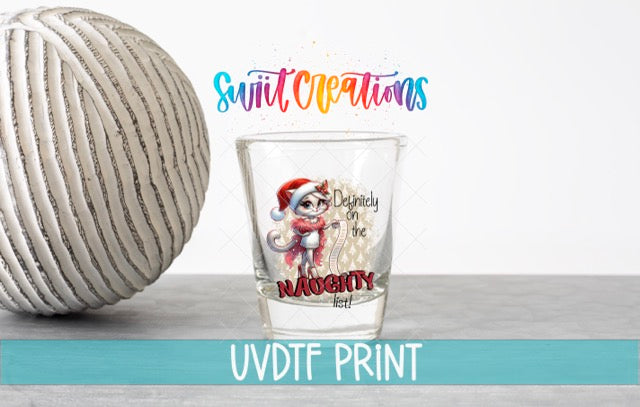a glass with a cartoon character on it, placed next to a white ball. The text above the glass reads "Swift Creations" and "Definitely on the Naughty Fest". The text below the glass says "UVDF PRINT".