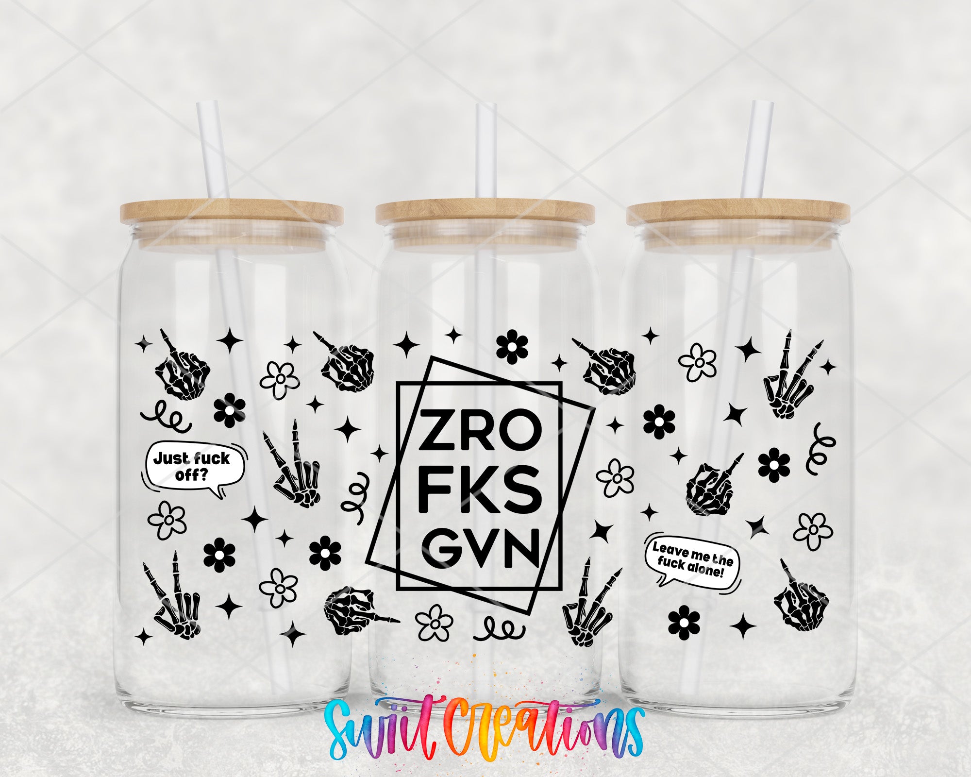 three clear glass jars with black and white designs and text on them.