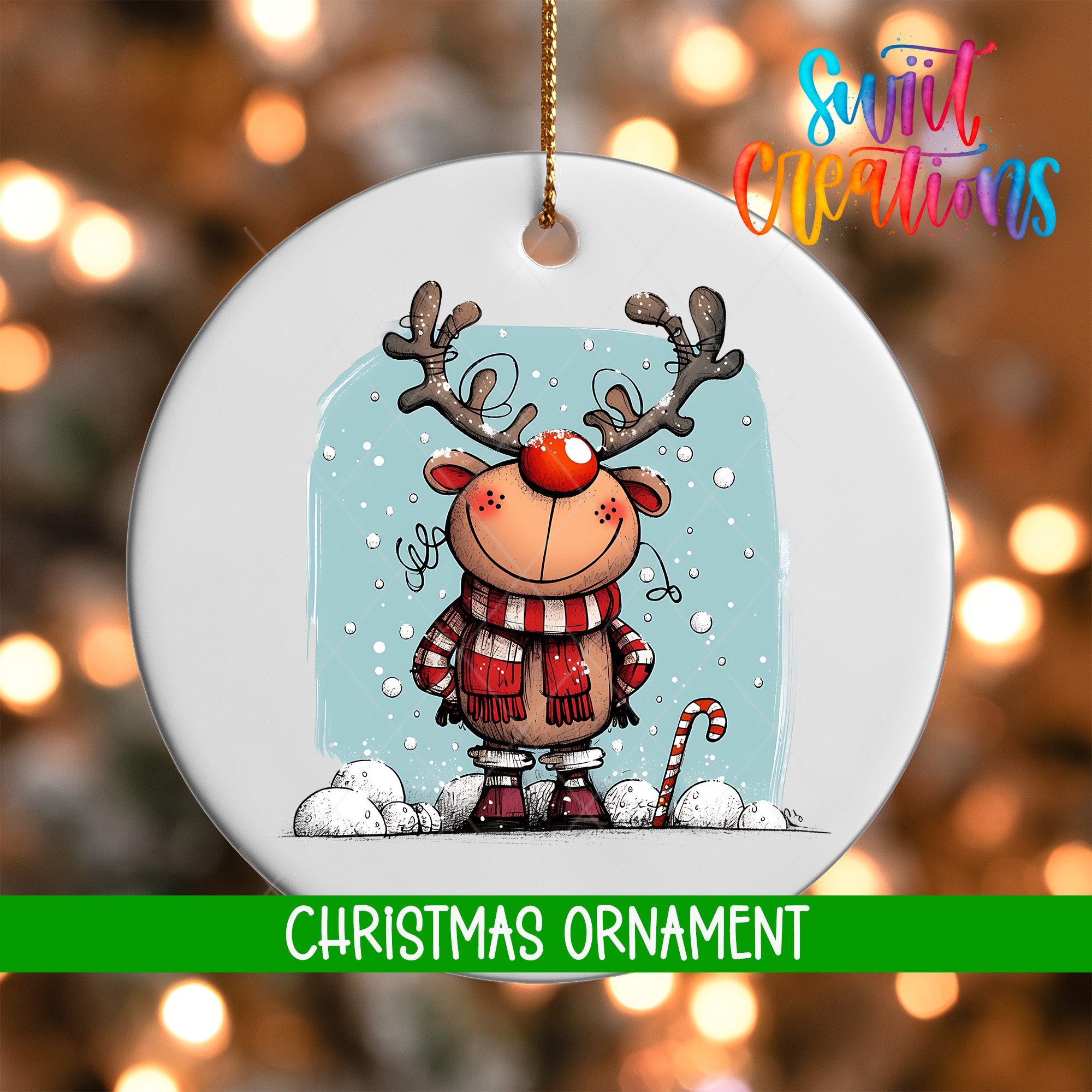 A white Christmas ornament featuring a cartoon reindeer with antlers and a red nose, standing on a snowy landscape with snowflakes falling around it.