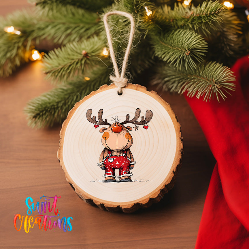 A wooden ornament featuring a cartoon reindeer with antlers, hanging on a Christmas tree.
