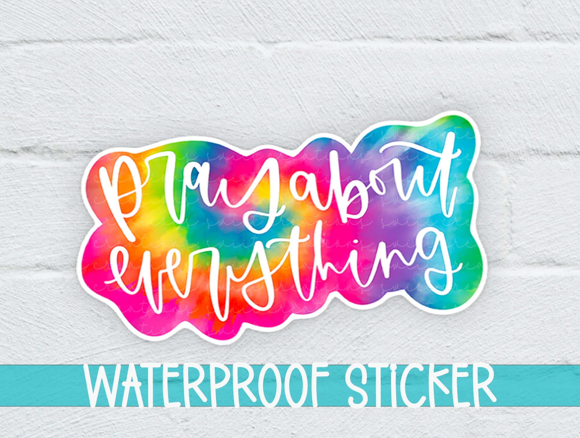 a watercolor sticker on a white brick wall