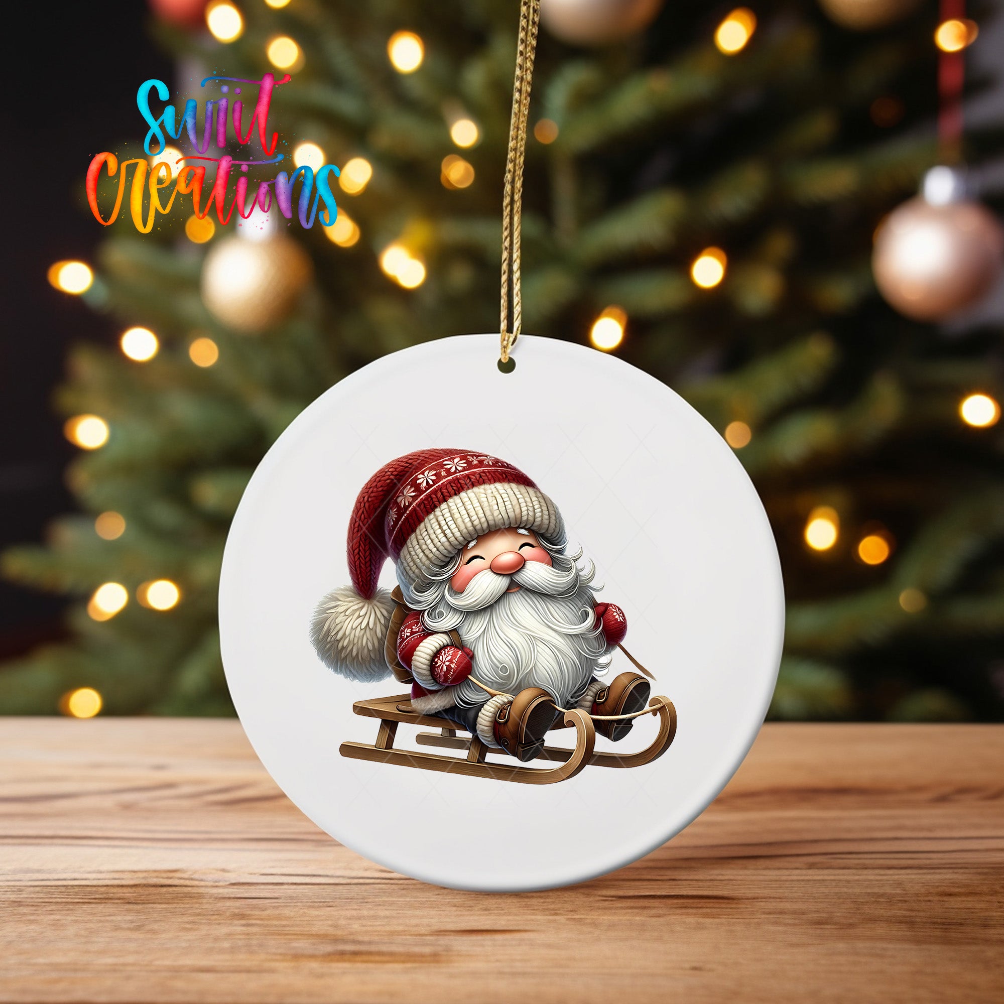 A white ornament featuring a smiling Santa Claus on a sled, with a blurred background of a Christmas tree and twinkling lights.