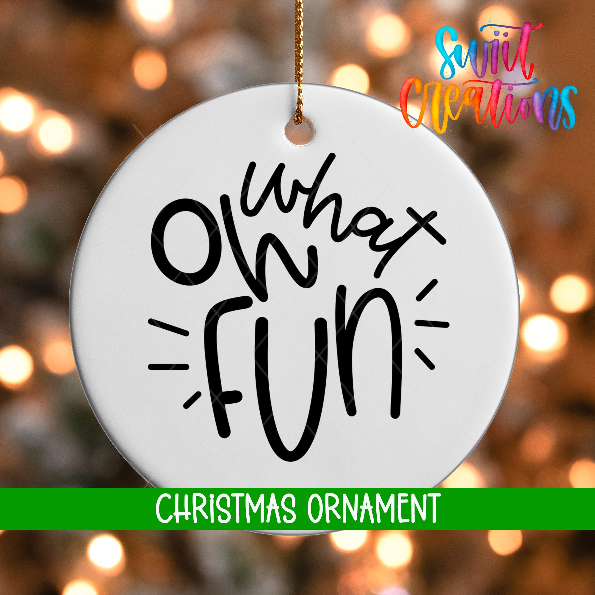 A white Christmas ornament with the text "What's fun" written on it, hanging against a background of colorful lights.