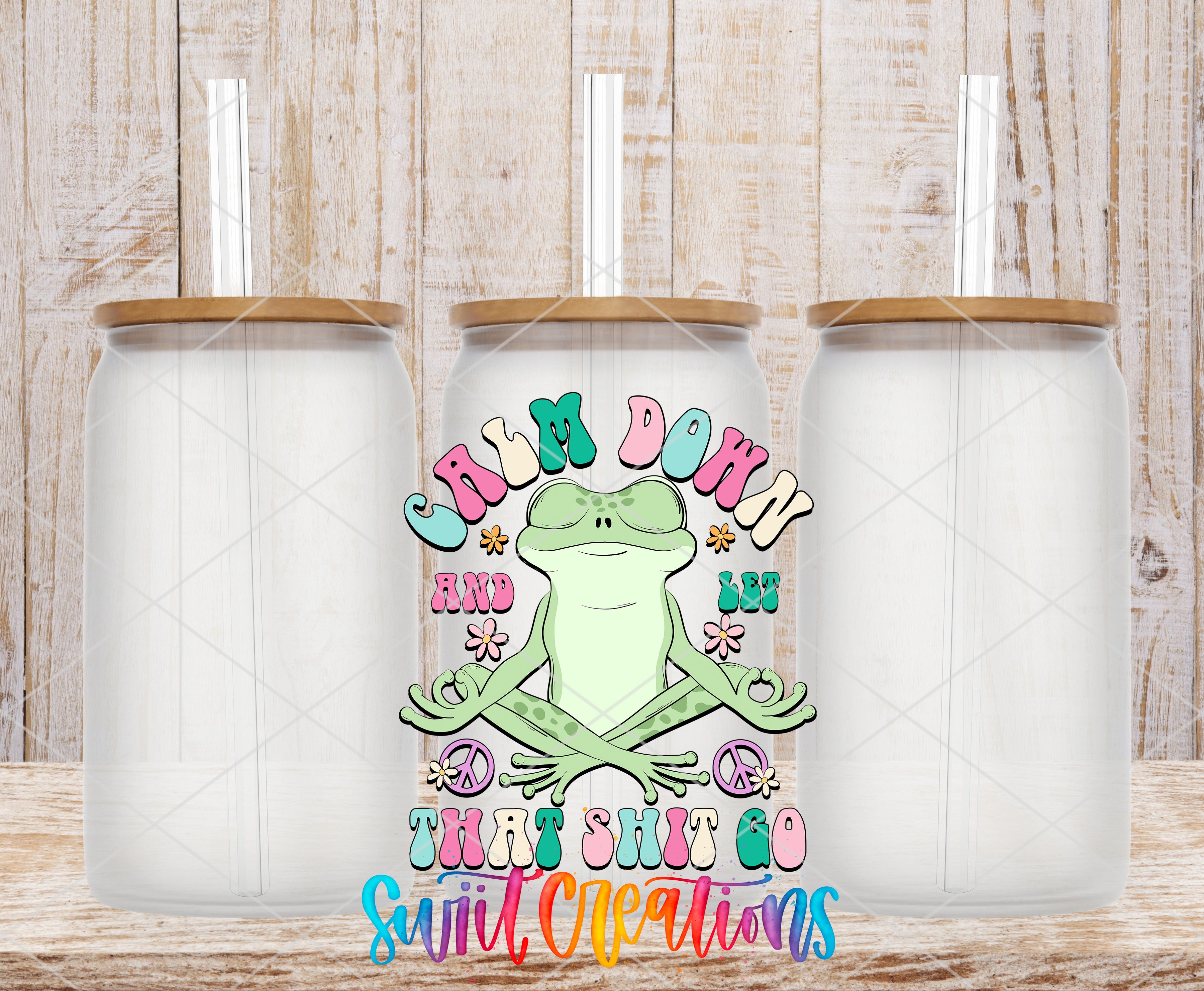 Swiit Creations UV DTF Calm Down And Let That Shit Go transfer shown on a clear glass can set