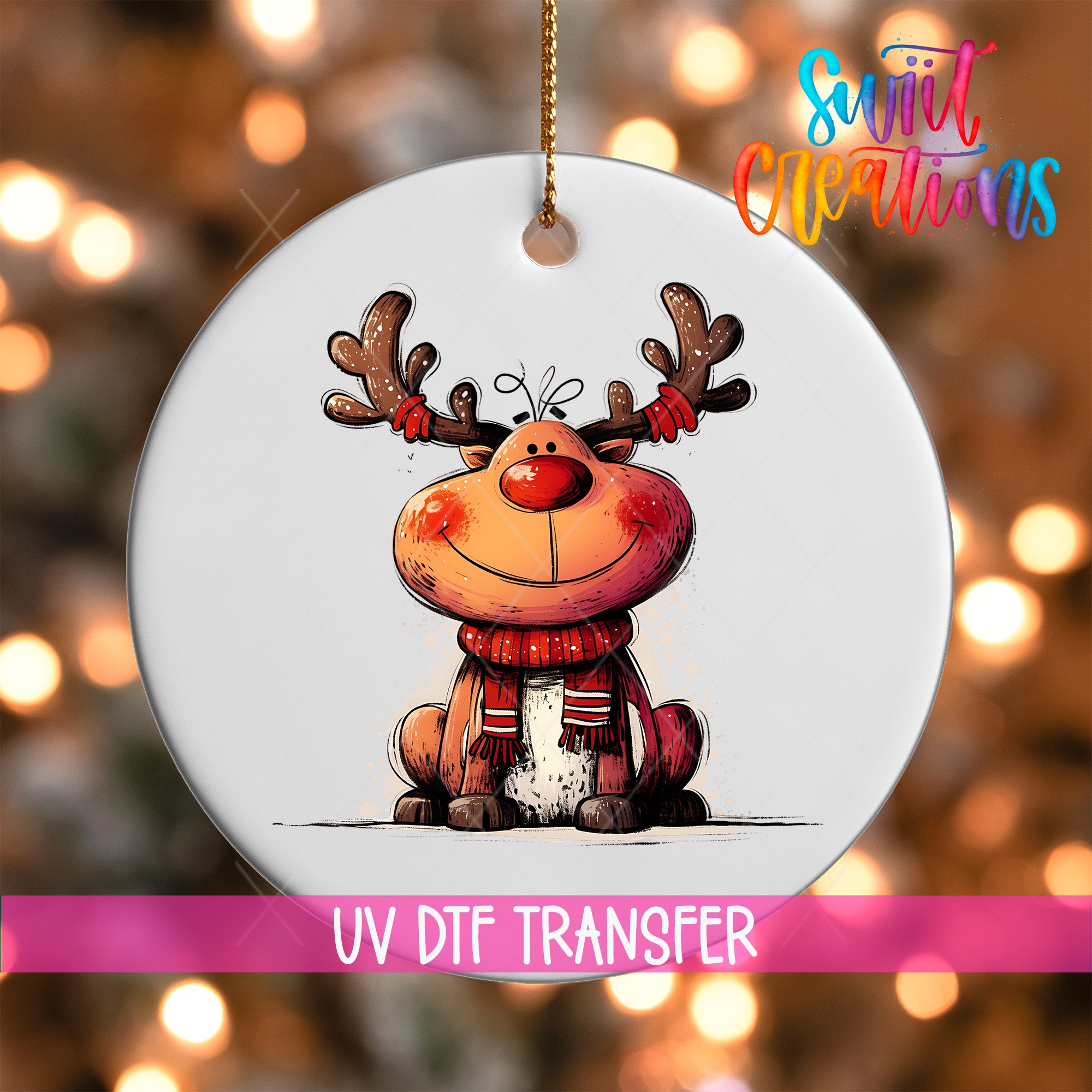 A white ornament with a cartoon reindeer wearing a red scarf and antlers, with a pink ribbon around it.