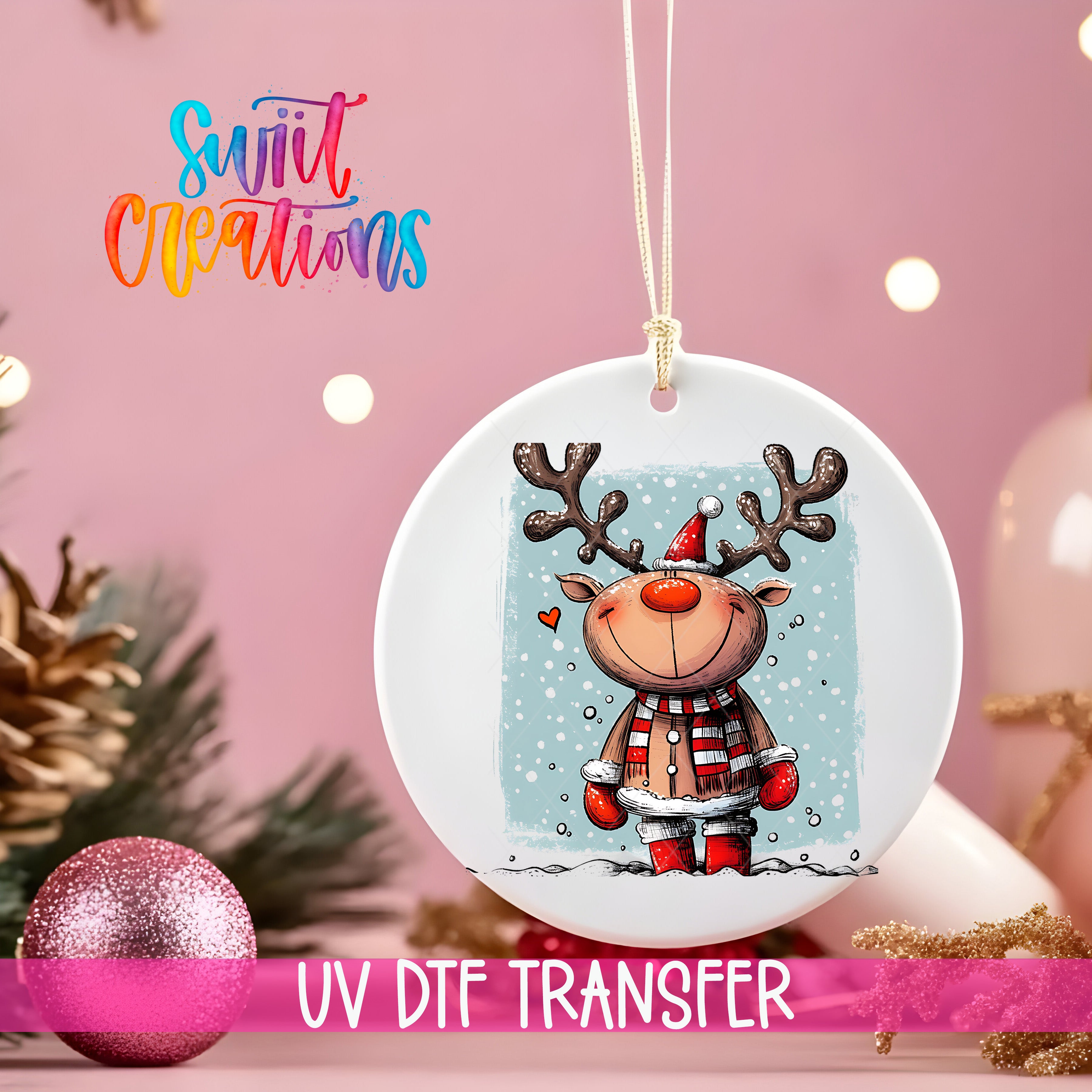 A white ornament with a cartoon reindeer and snowflakes hanging on a string, with a pink background and Christmas decorations in the background.