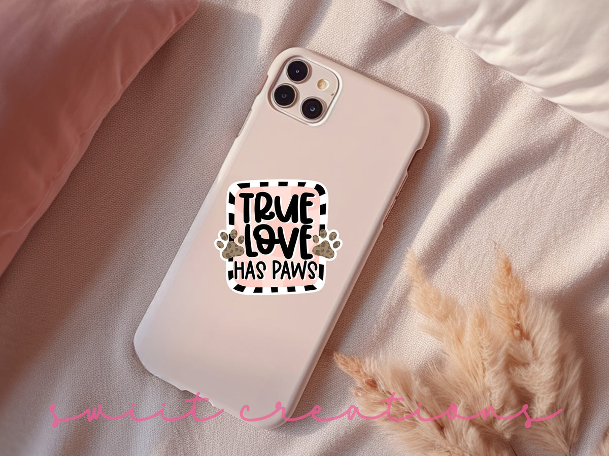 True Love Has Paws sticker on a pink phone case