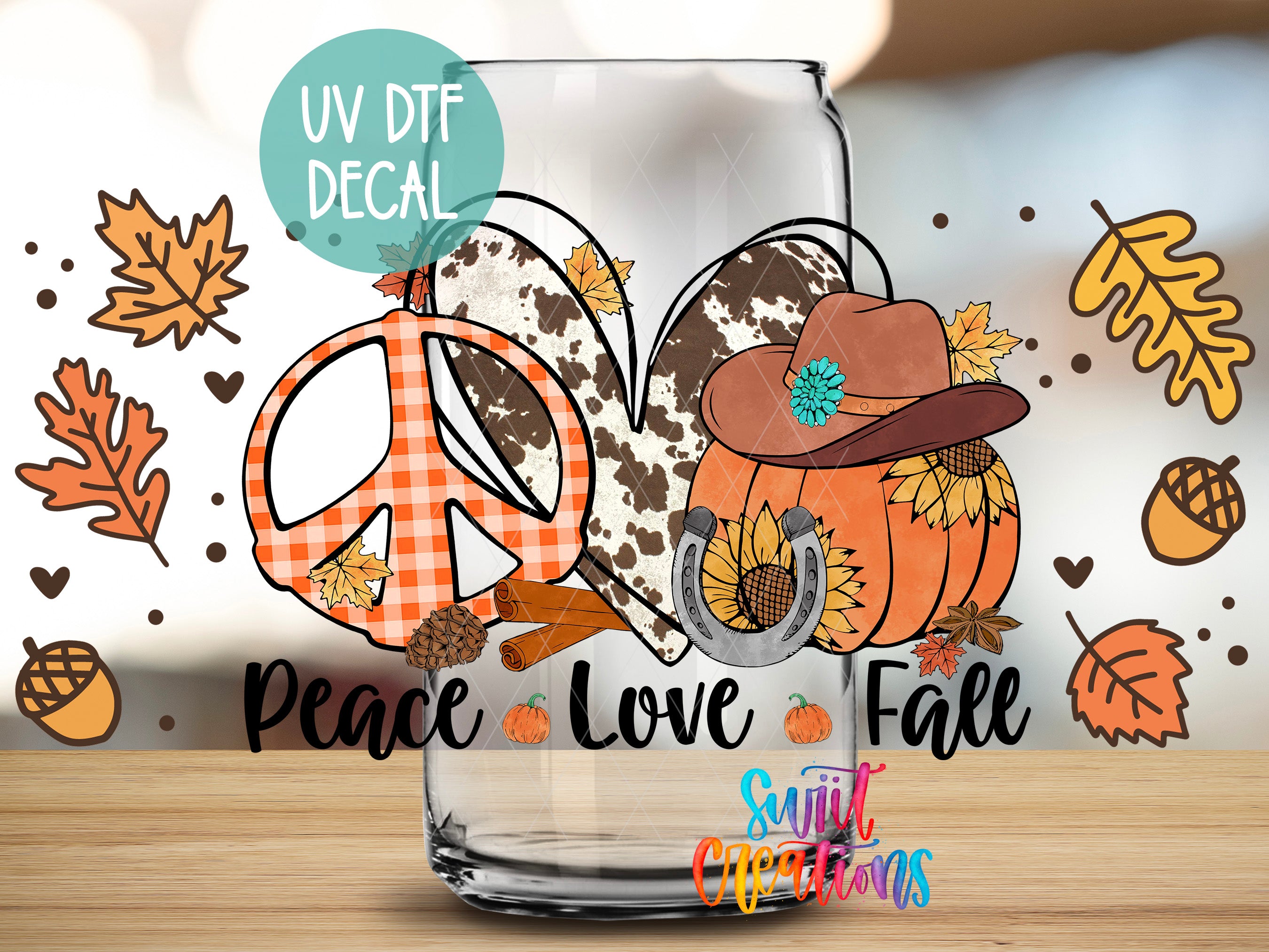 a glass with a peace love fall design on it
