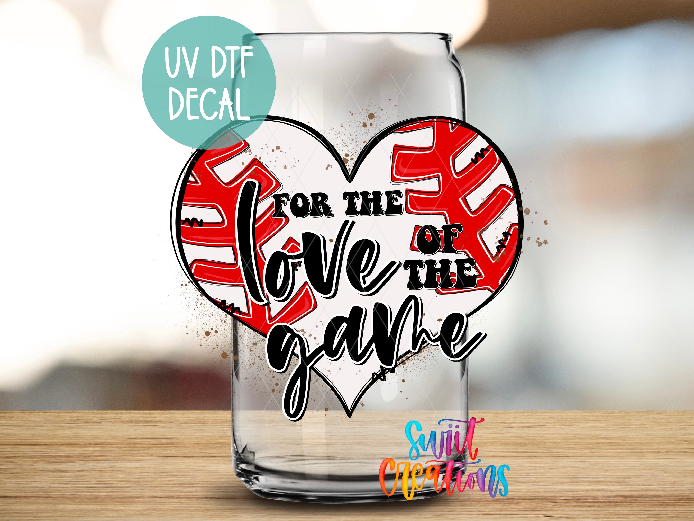 a glass with a heart and a baseball on it
