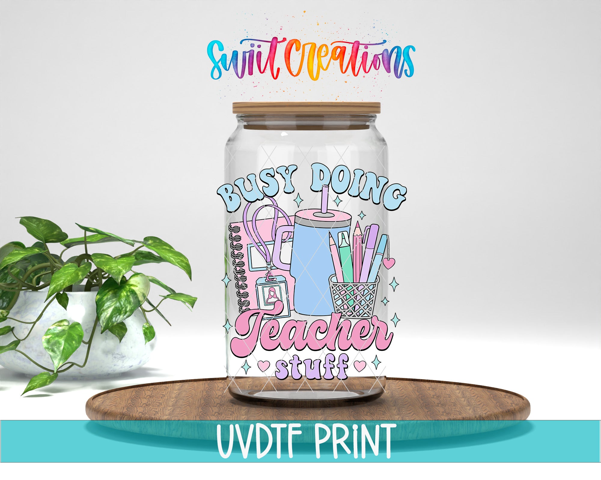 A glass jar with a colorful design featuring a teacher's supplies, such as pencils, scissors, and a notebook, along with the text "Busy Doing Teacher Stuff" and "Swift Creations".