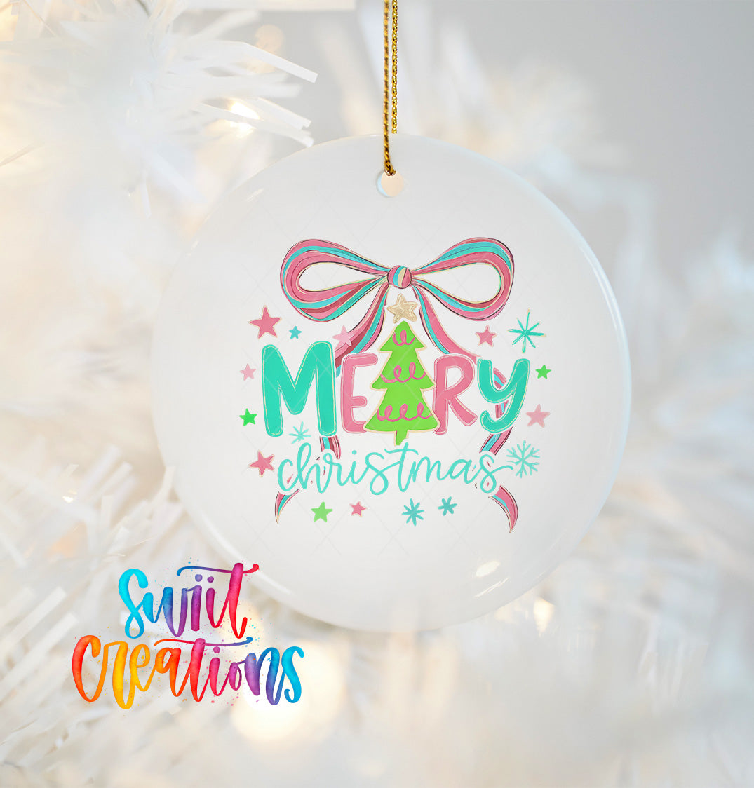 A white Christmas ornament with a colorful design featuring a bow, stars, and the text "Merry Christmas" hanging on a string.