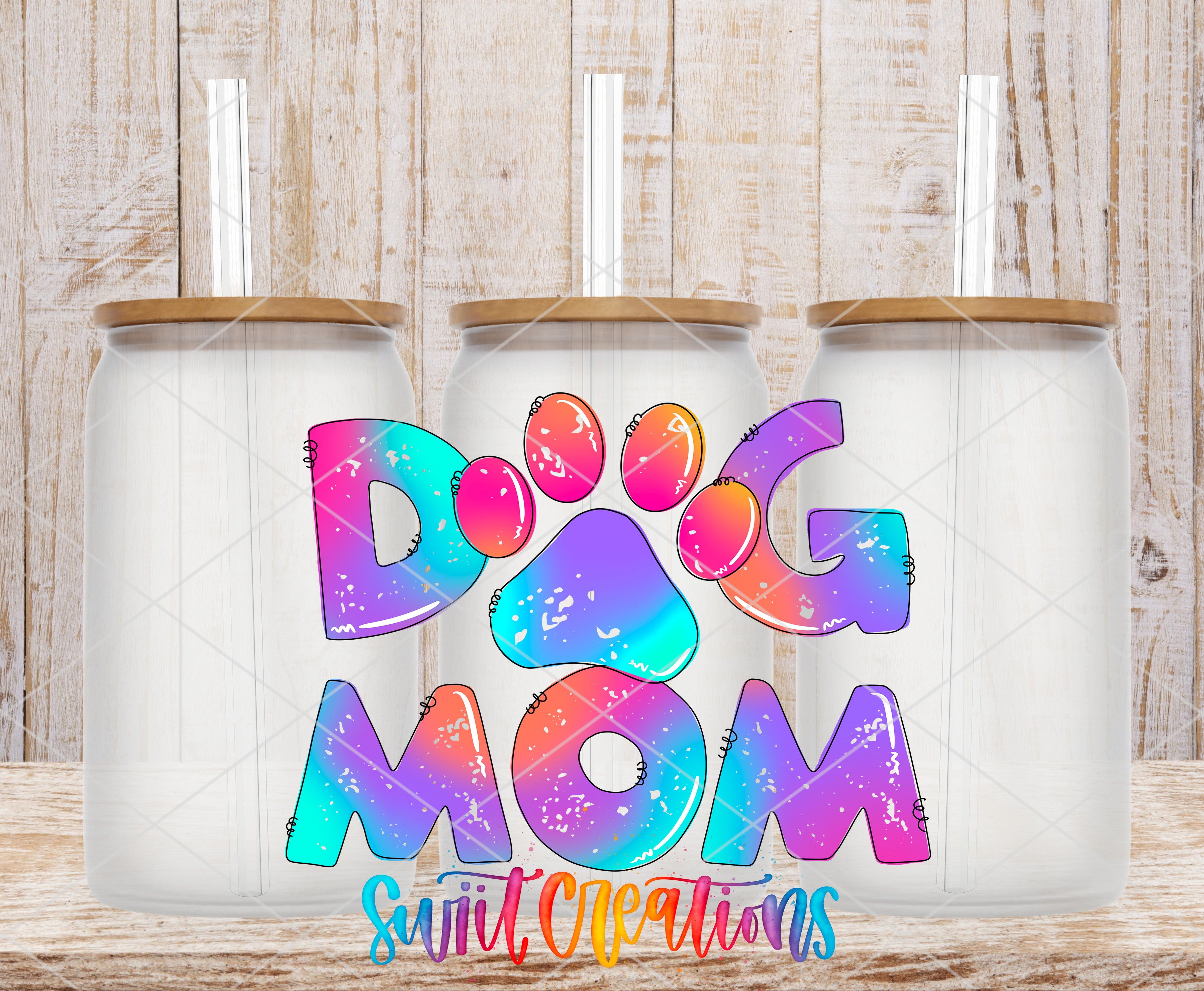 Swiit Creations UV DTF Fur Mama Dog Mom Tie Dye transfer shown on a clear glass can set