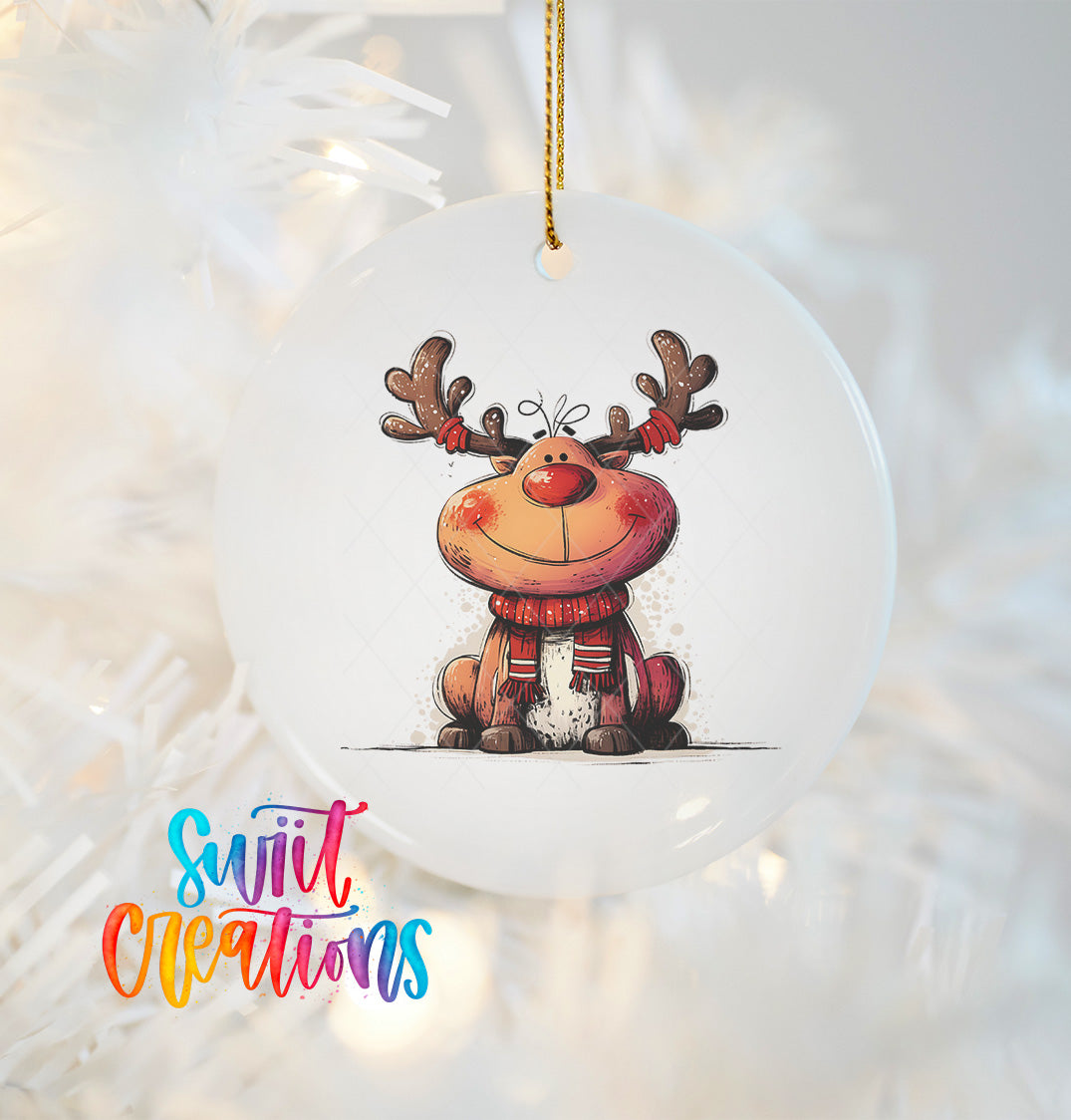 A white ornament with a cartoon reindeer design hanging on a string.