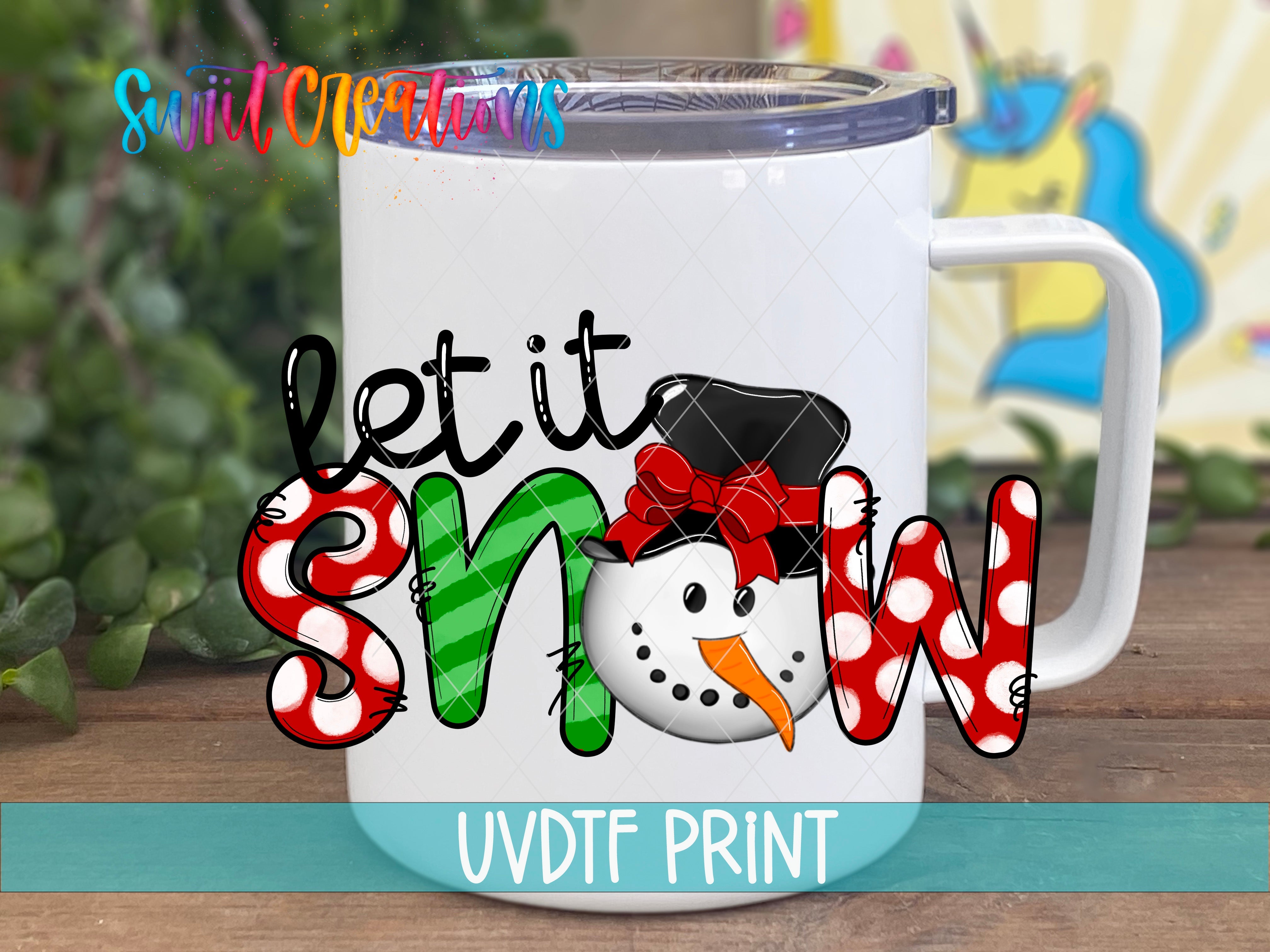a white coffee mug with the words let it snow on it
