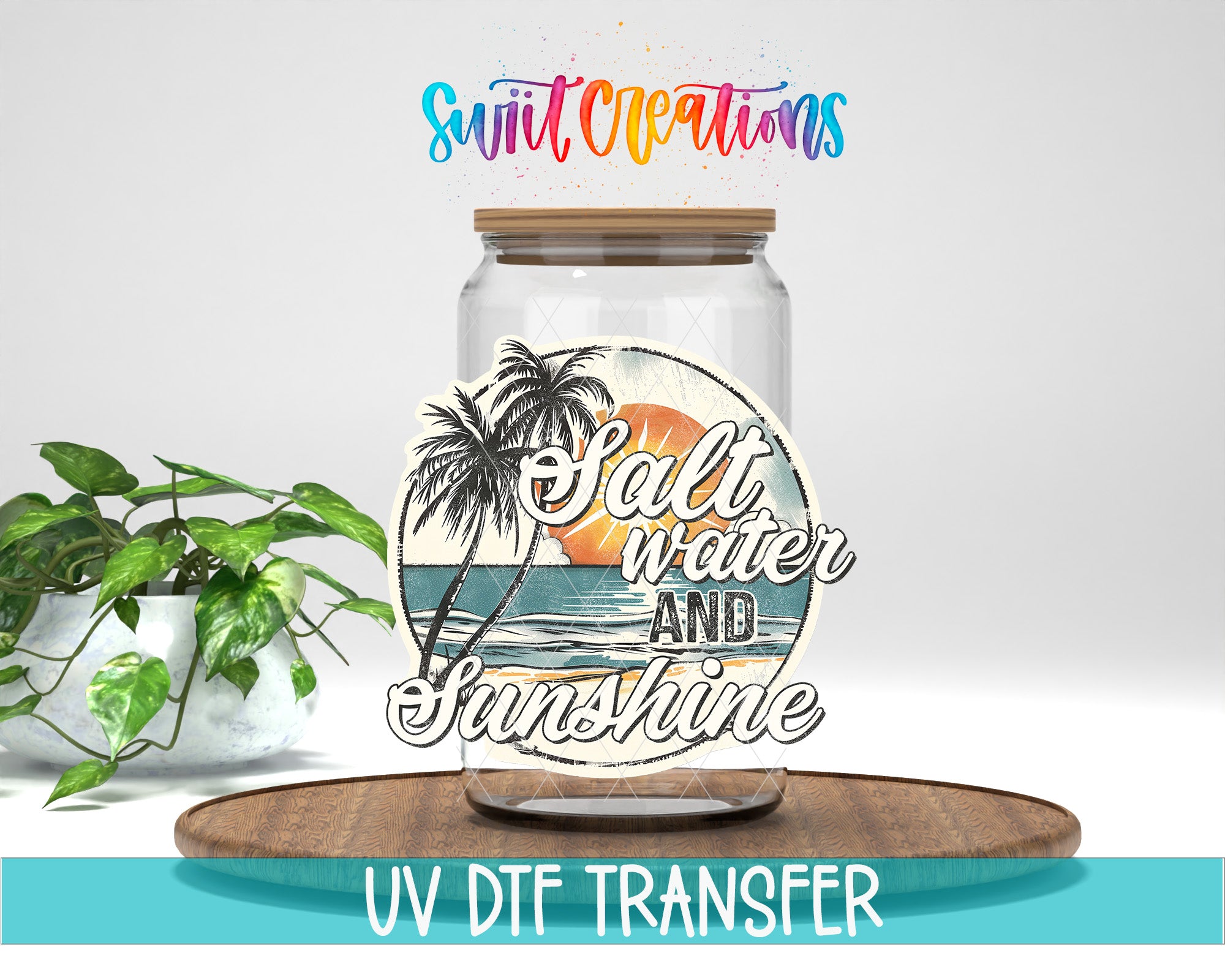a glass jar with a tropical beach scene and the text "Salt Water and Sunshine" on it, placed on a wooden surface. There is also a potted plant in the background.