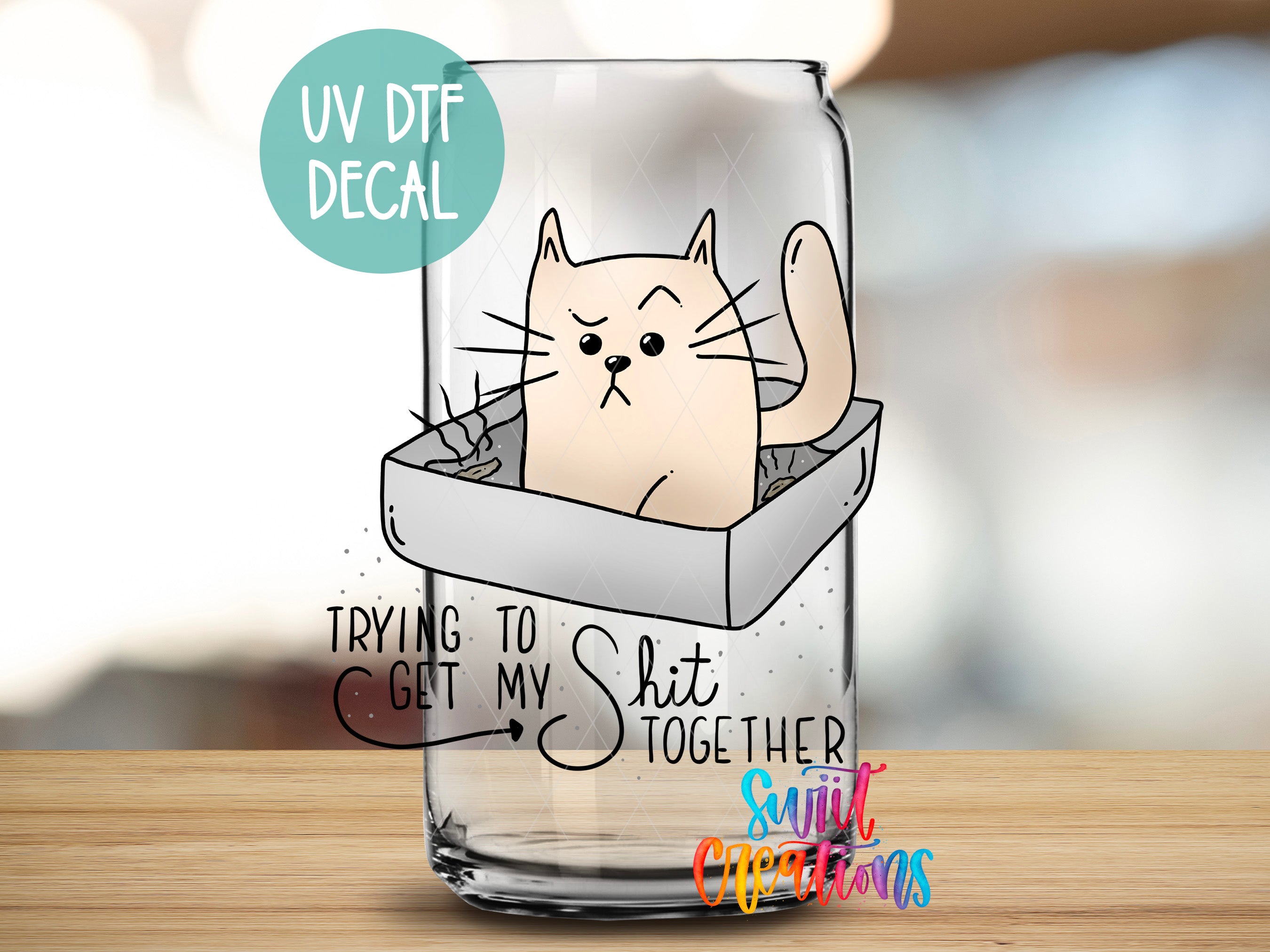 a glass with a picture of a cat inside of it