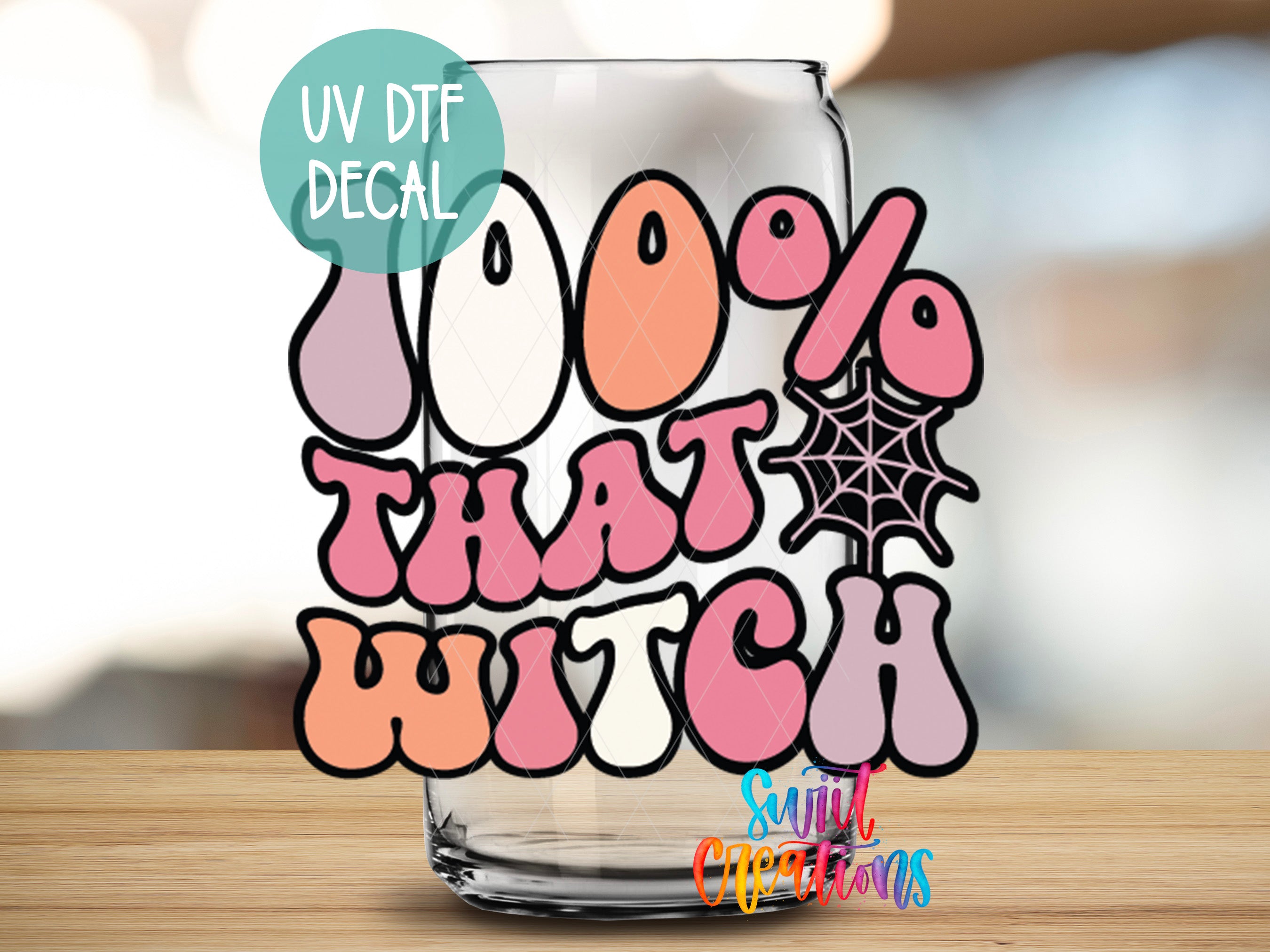 a glass with a sticker that says, 100 % that witch