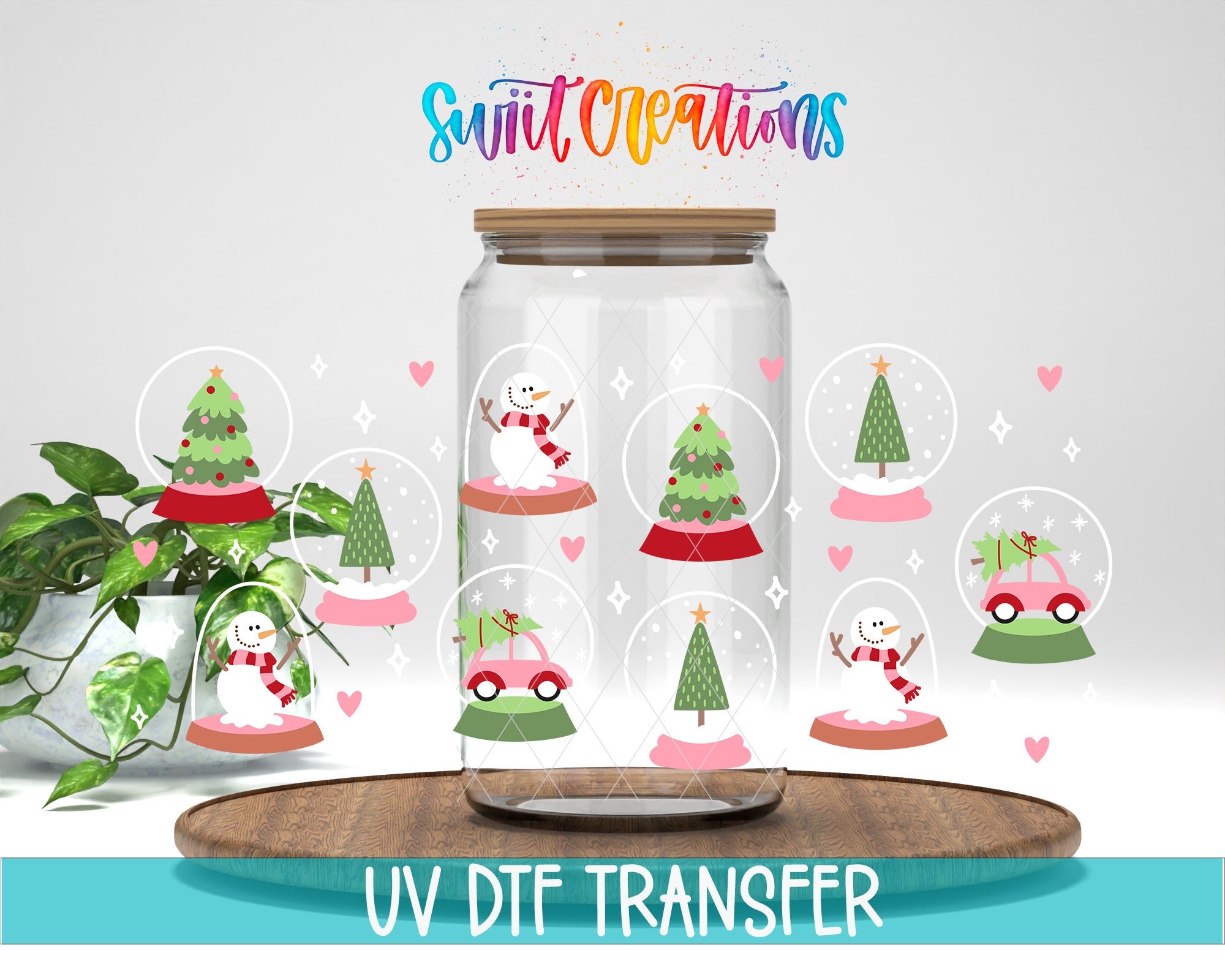 A glass jar filled with snow globes containing various Christmas-themed illustrations, including a snowman, Christmas tree, and other festive elements. The jar is placed on a wooden surface, and there is a plant in the background. The image also includes text that reads "Swift Creations UV Dtf Transfer".