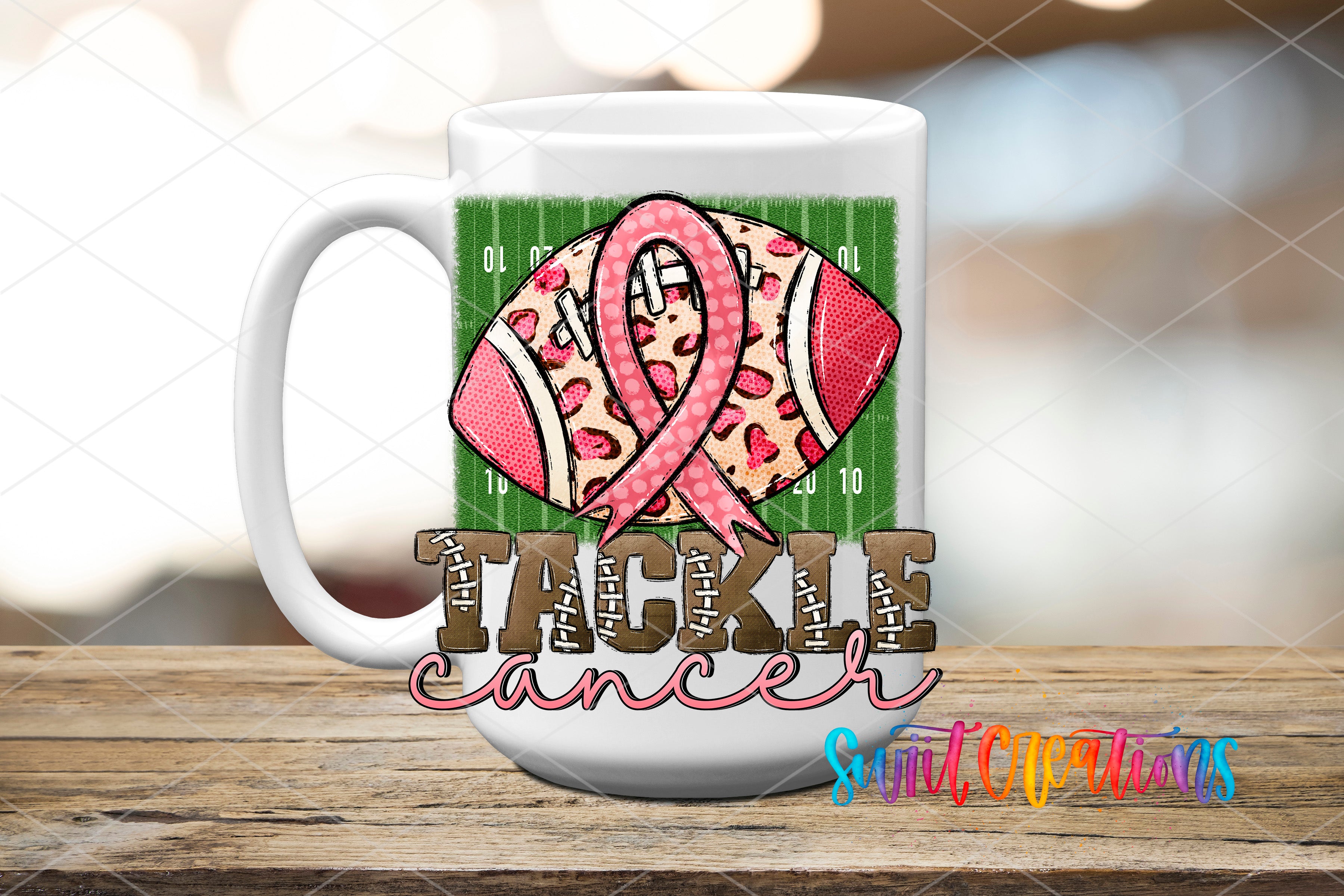 A white mug with a football design and a pink ribbon, representing the "Tackle Cancer" theme.