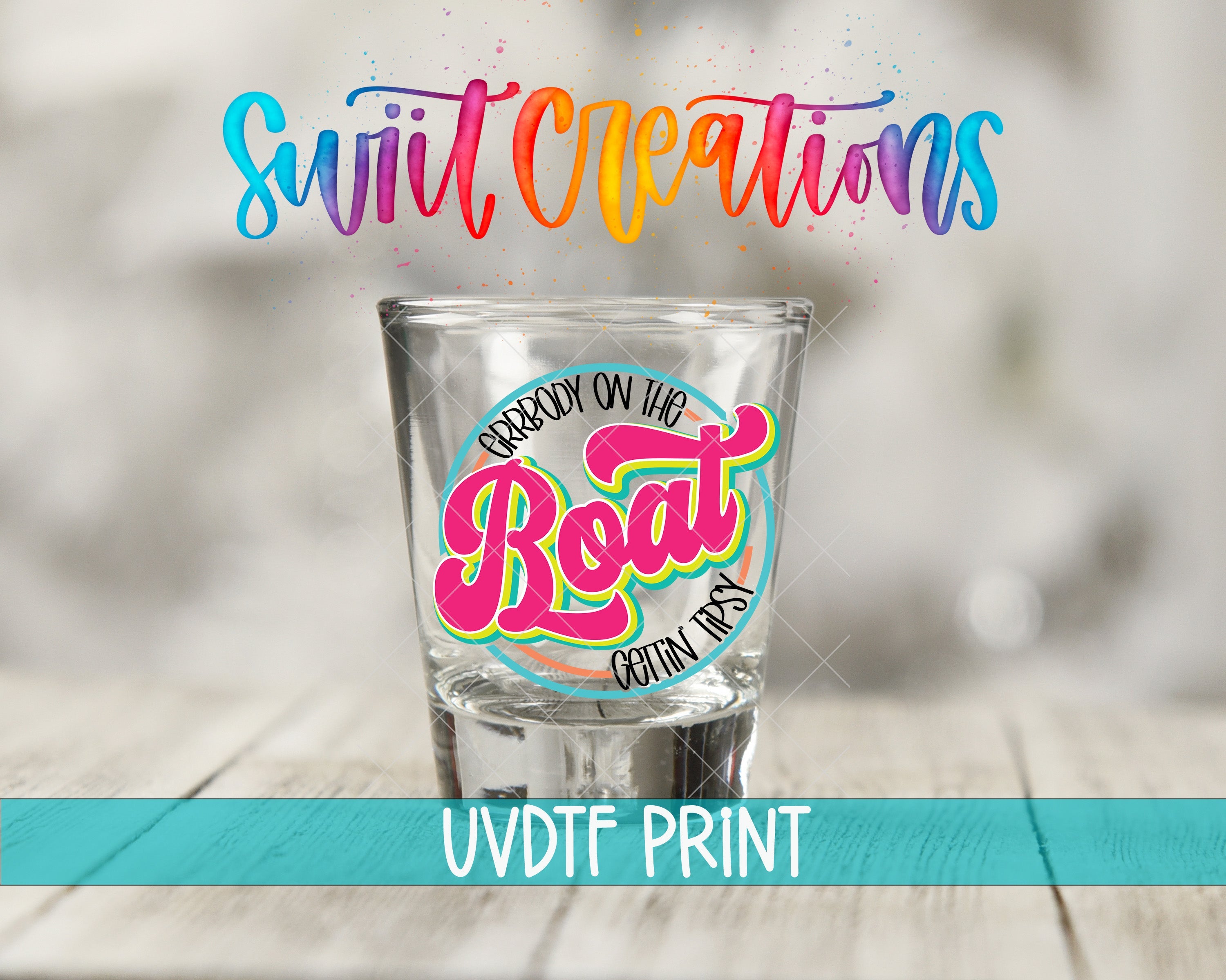 a shot glass sitting on top of a wooden table