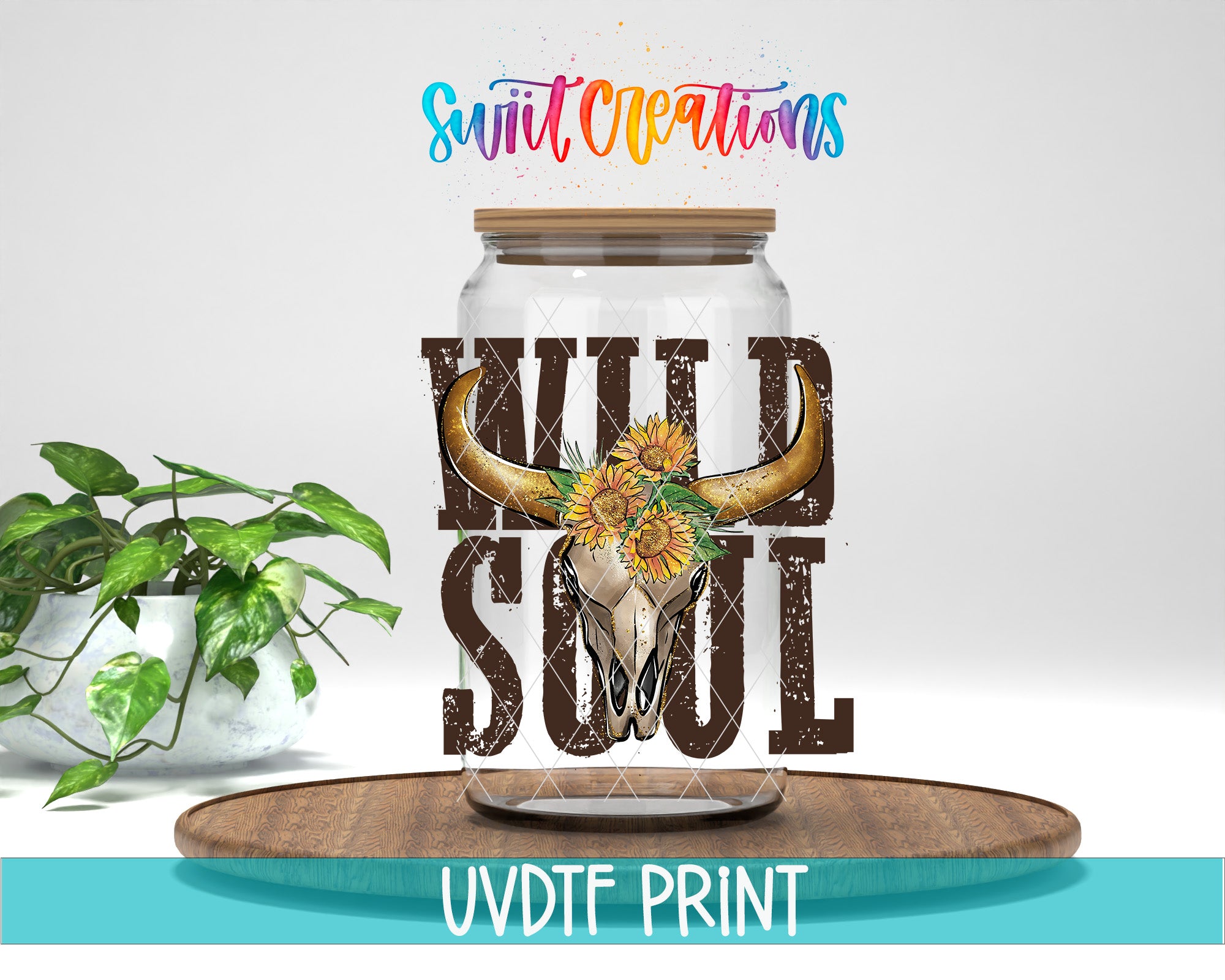 a glass jar with a painted design of a horned animal, possibly a bison or a bull, and sunflowers. The jar is placed on a wooden surface, and there is a potted plant in the background. The text "Swift Creations" is written above the jar, and "WILD Soul" is written below it. The image also includes the text "UVDF PRINT" at the bottom.
