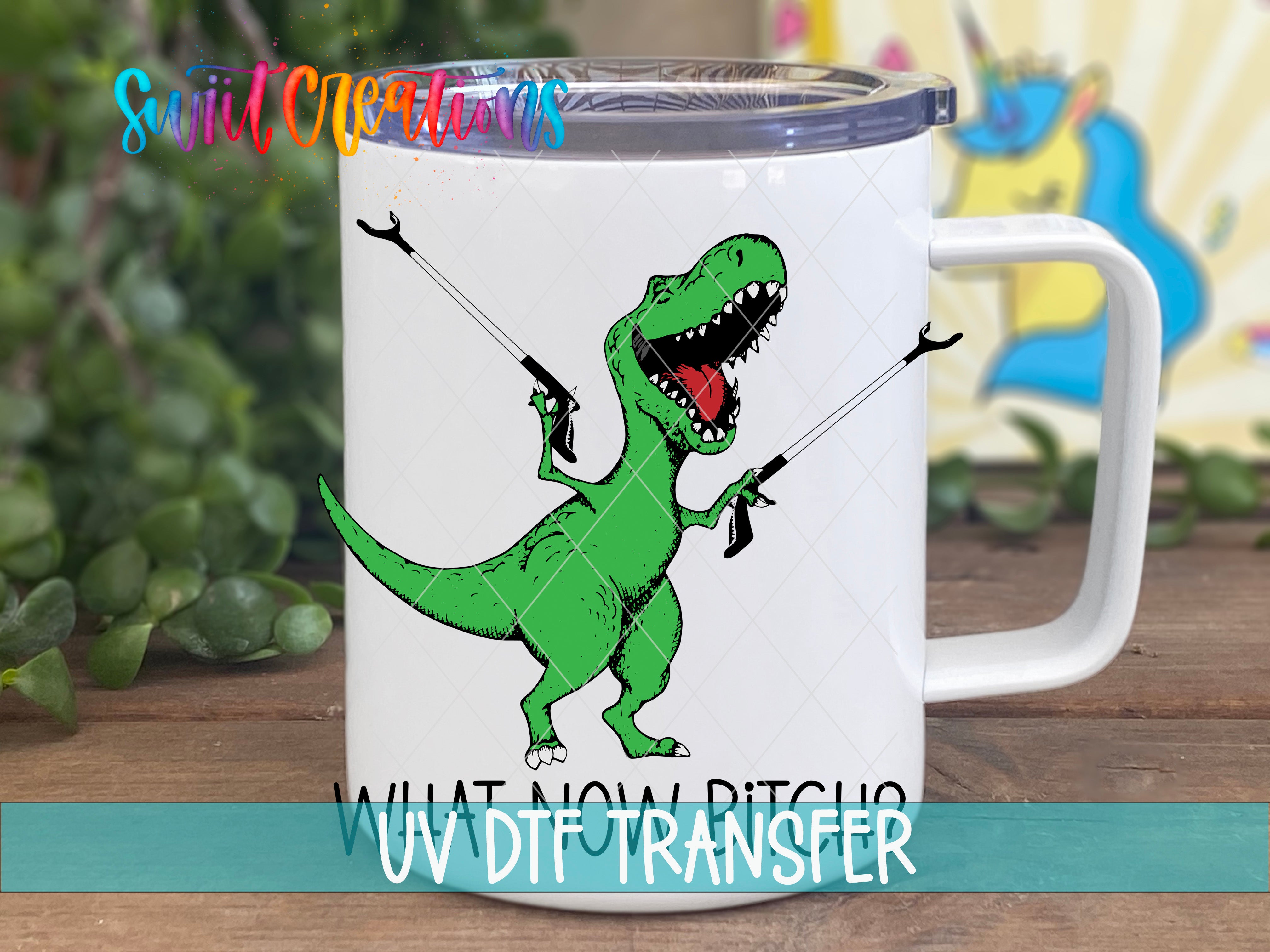 Swiit Creations UV DTF What Now Bitch Dinasaur transfer displayed on a white coffee mug