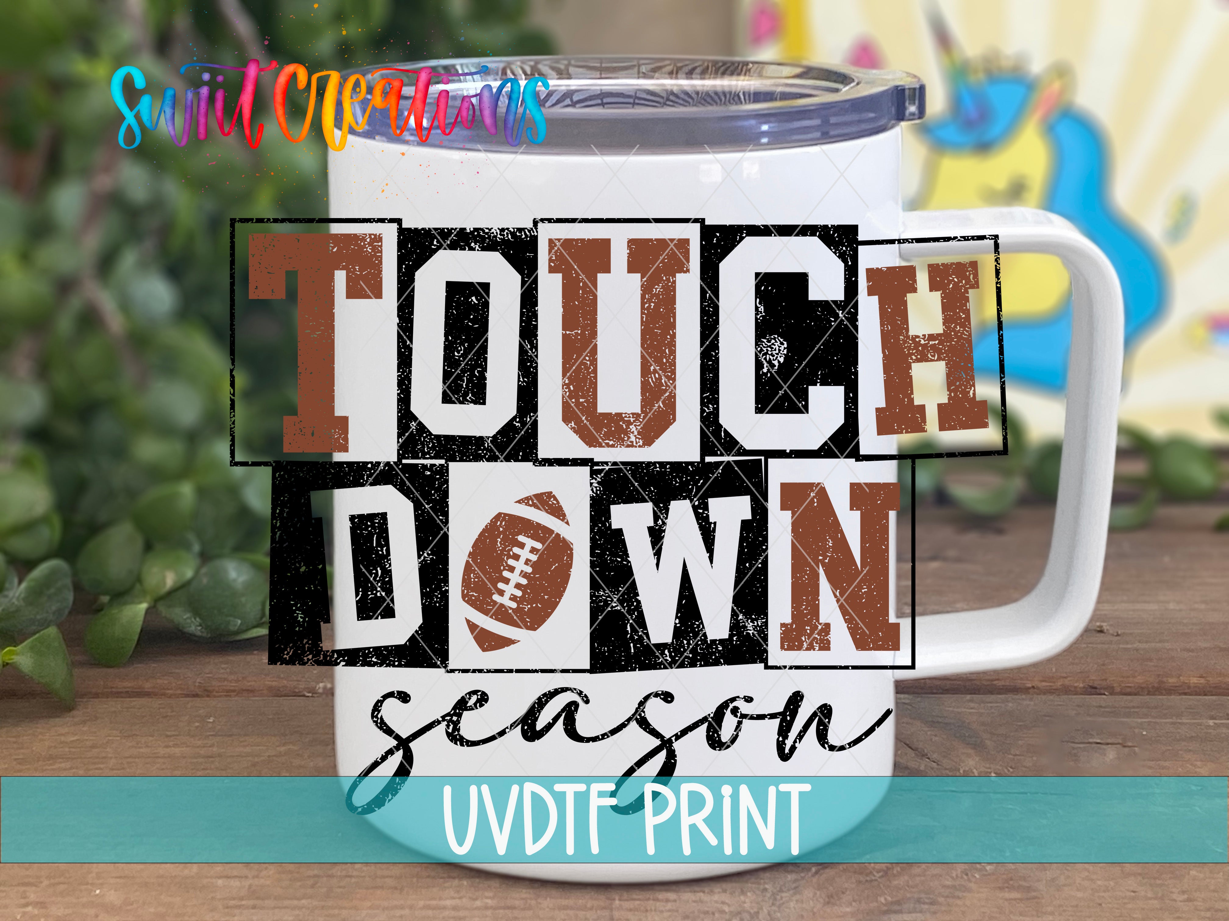 a coffee mug with the words touch down season on it