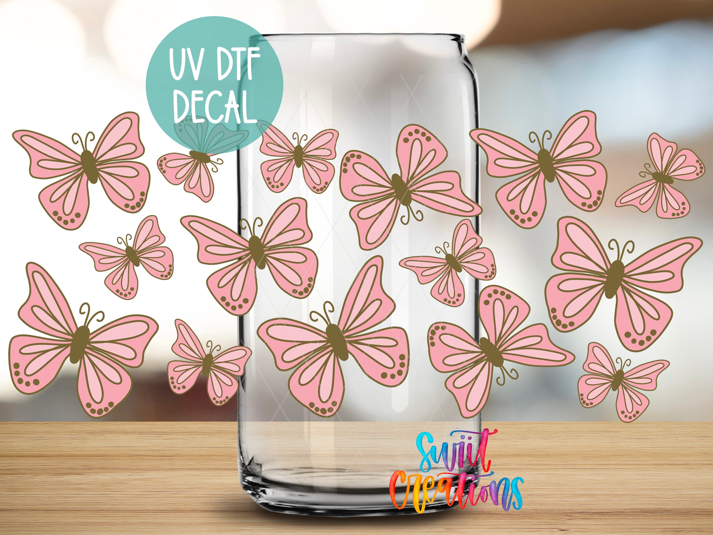 a clear glass jar with a collection of pink butterflies printed on it.