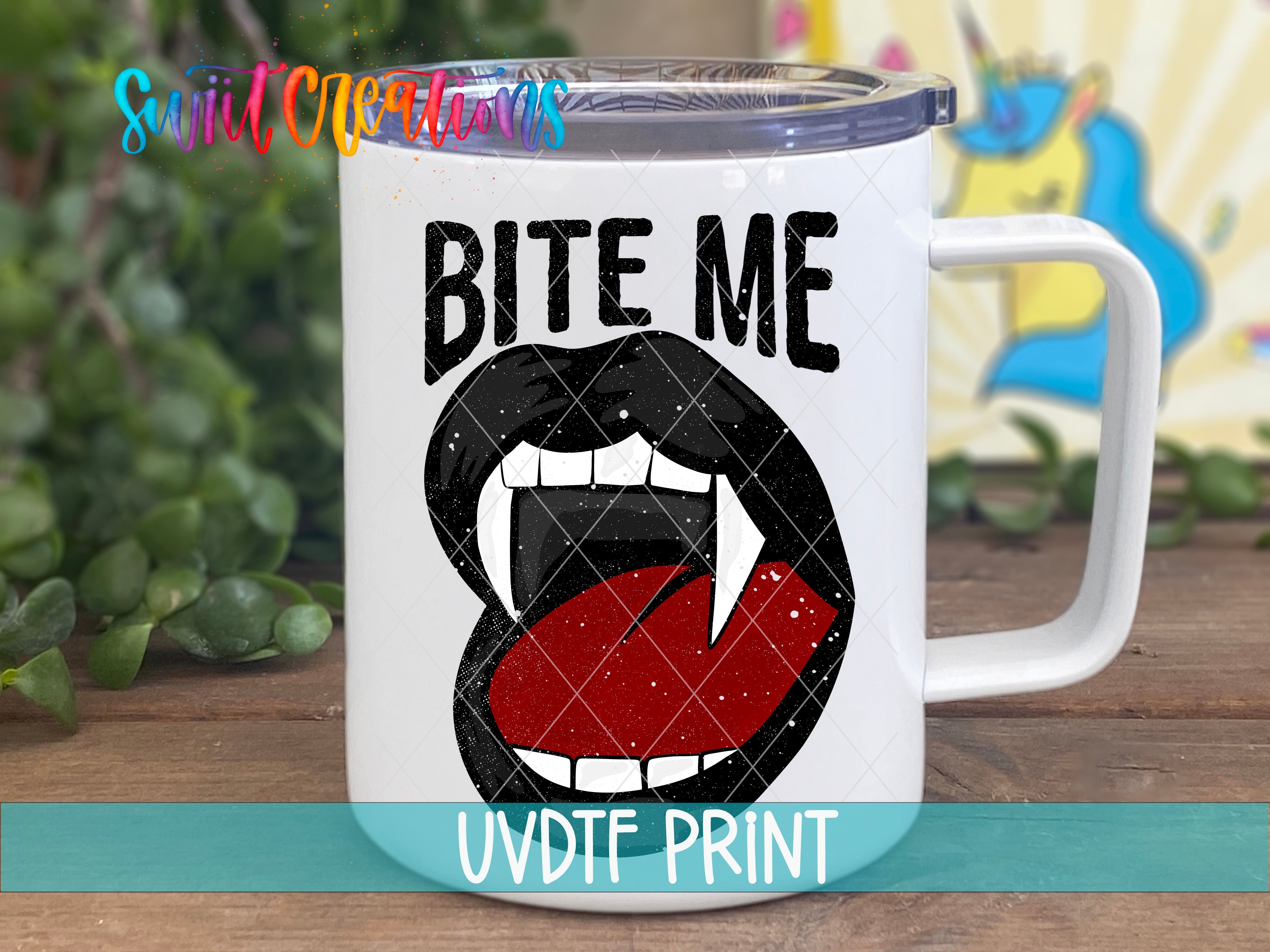 a white coffee mug with the words bite me on it