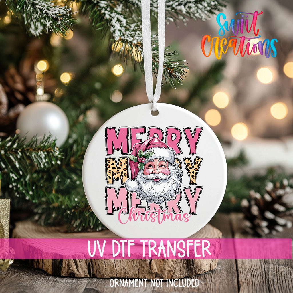 A white Christmas ornament with a Santa Claus face and the text "MERRY MARY CHRISTMAS" hanging on a Christmas tree.