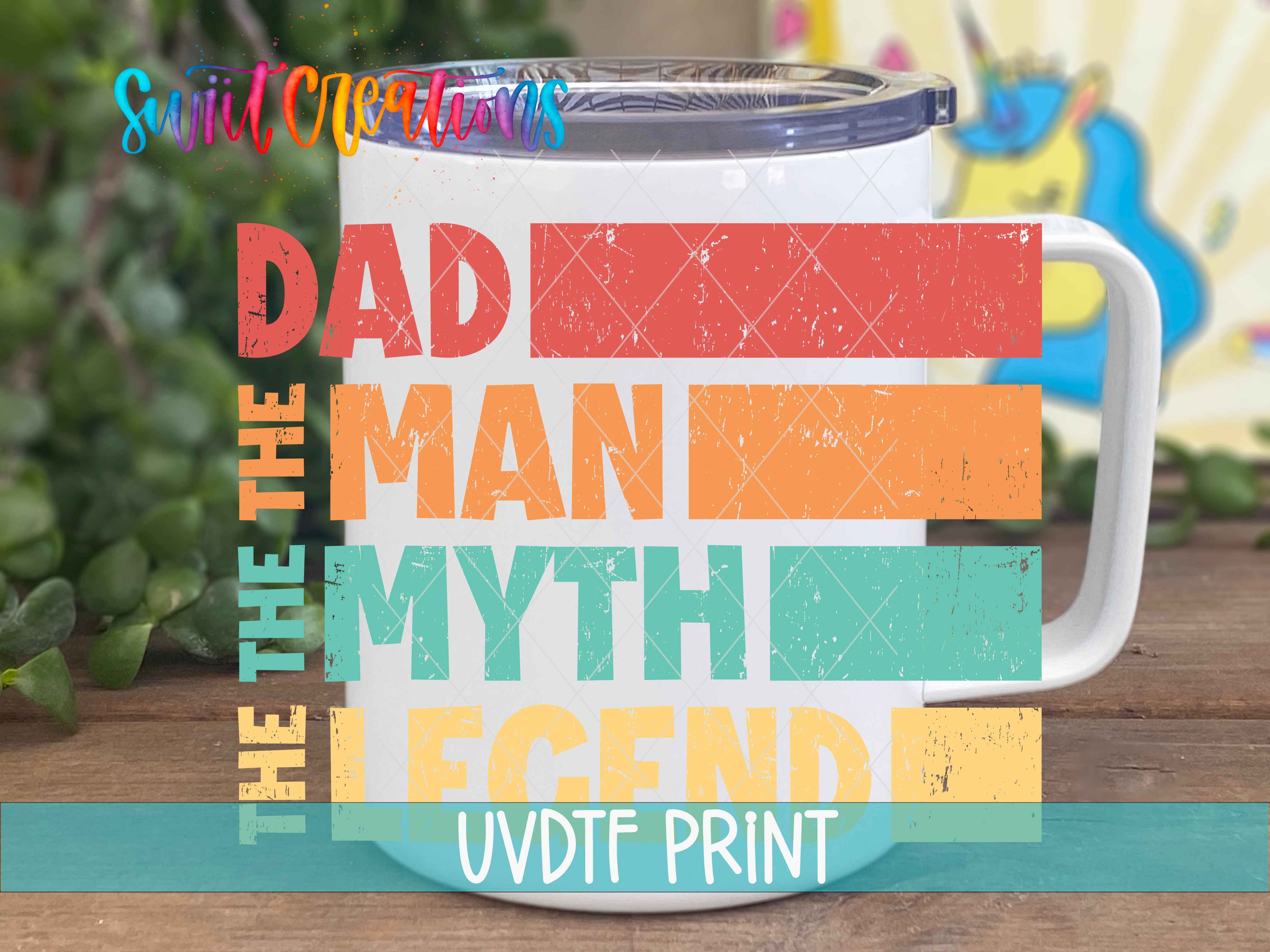 A mug with the text "The Dad Man Legend" printed on it, along with a colorful, cartoonish unicorn in the background.