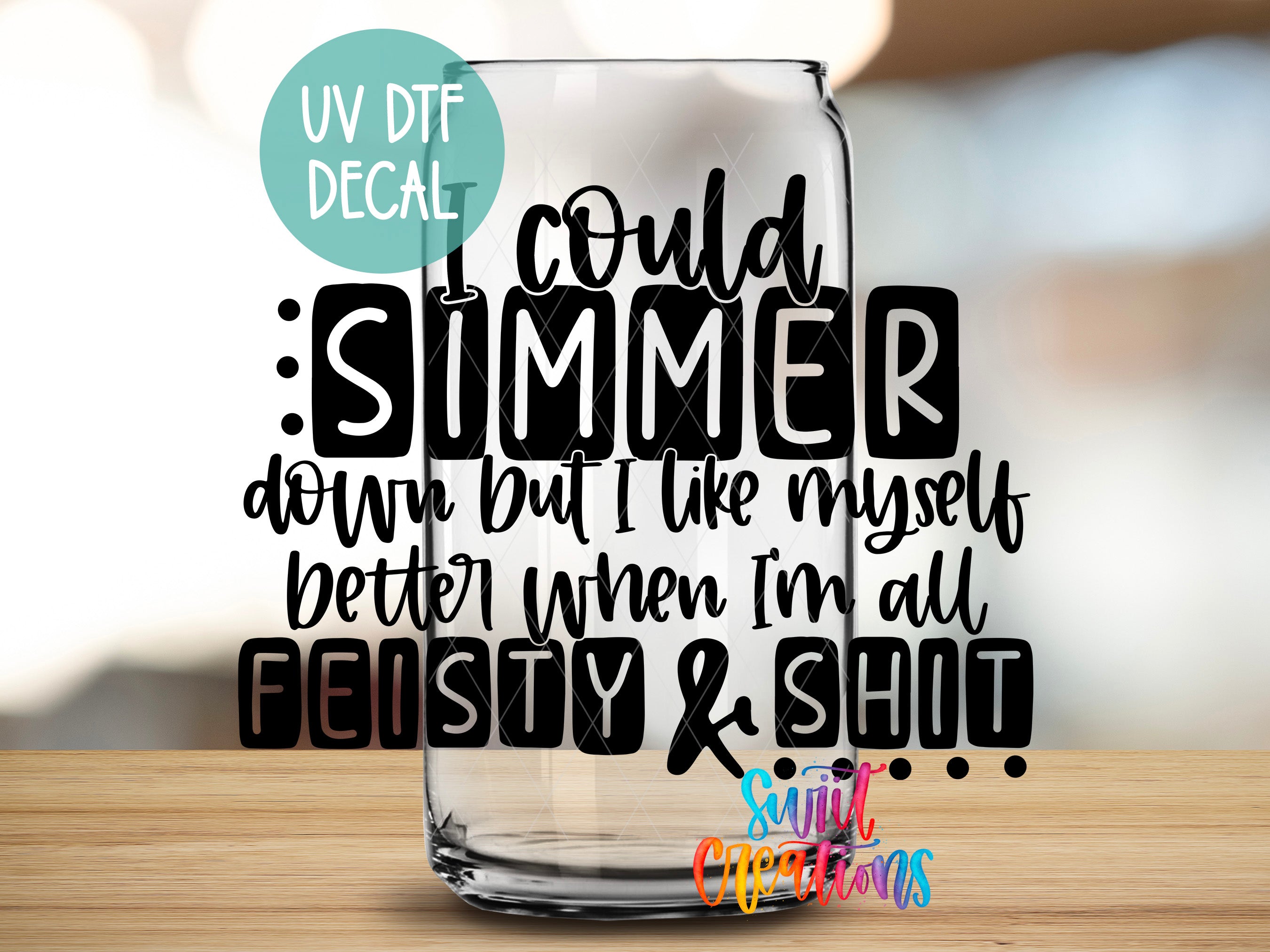 a glass with a quote on it sitting on a table