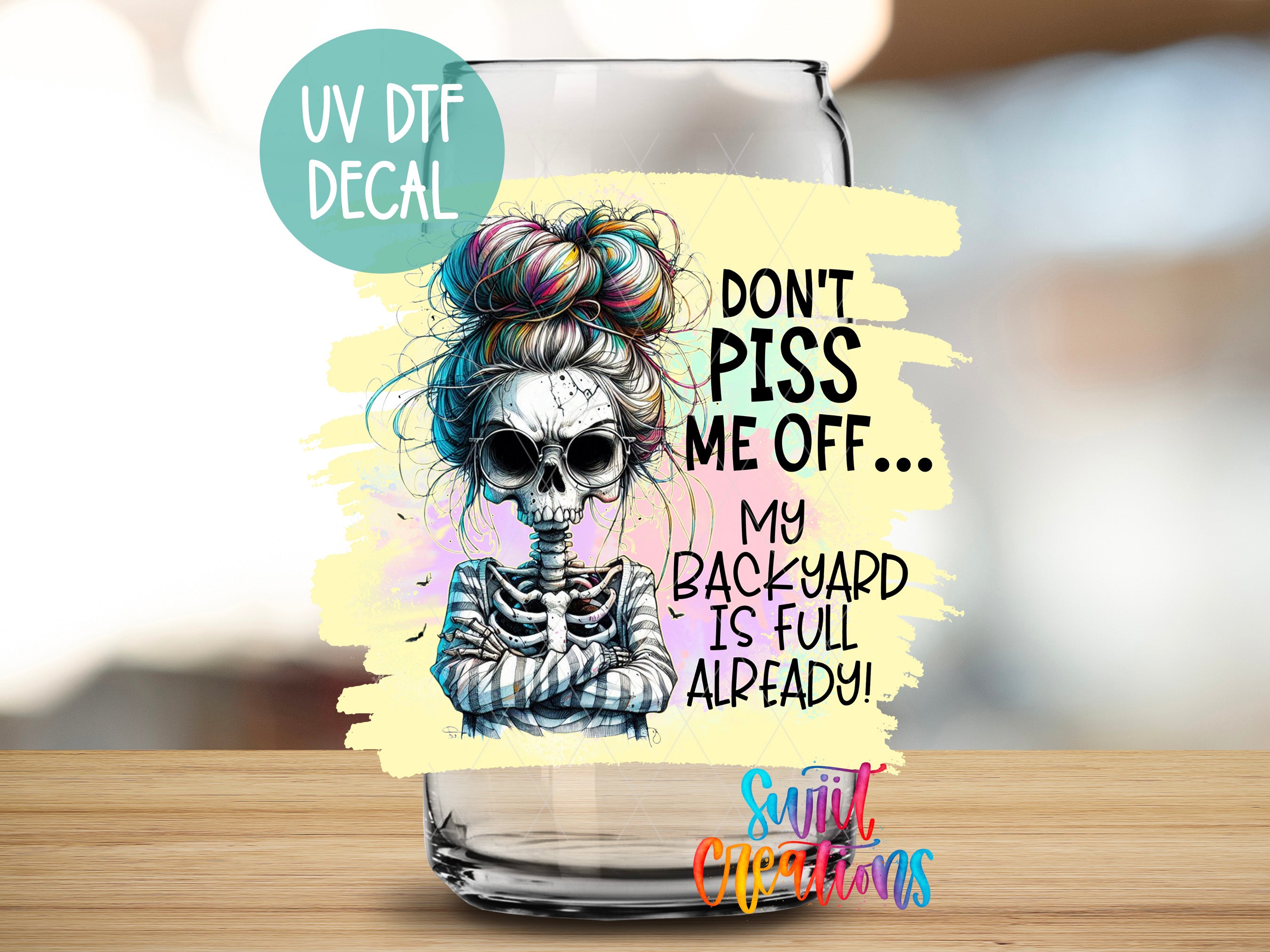 a glass with a picture of a skeleton on it