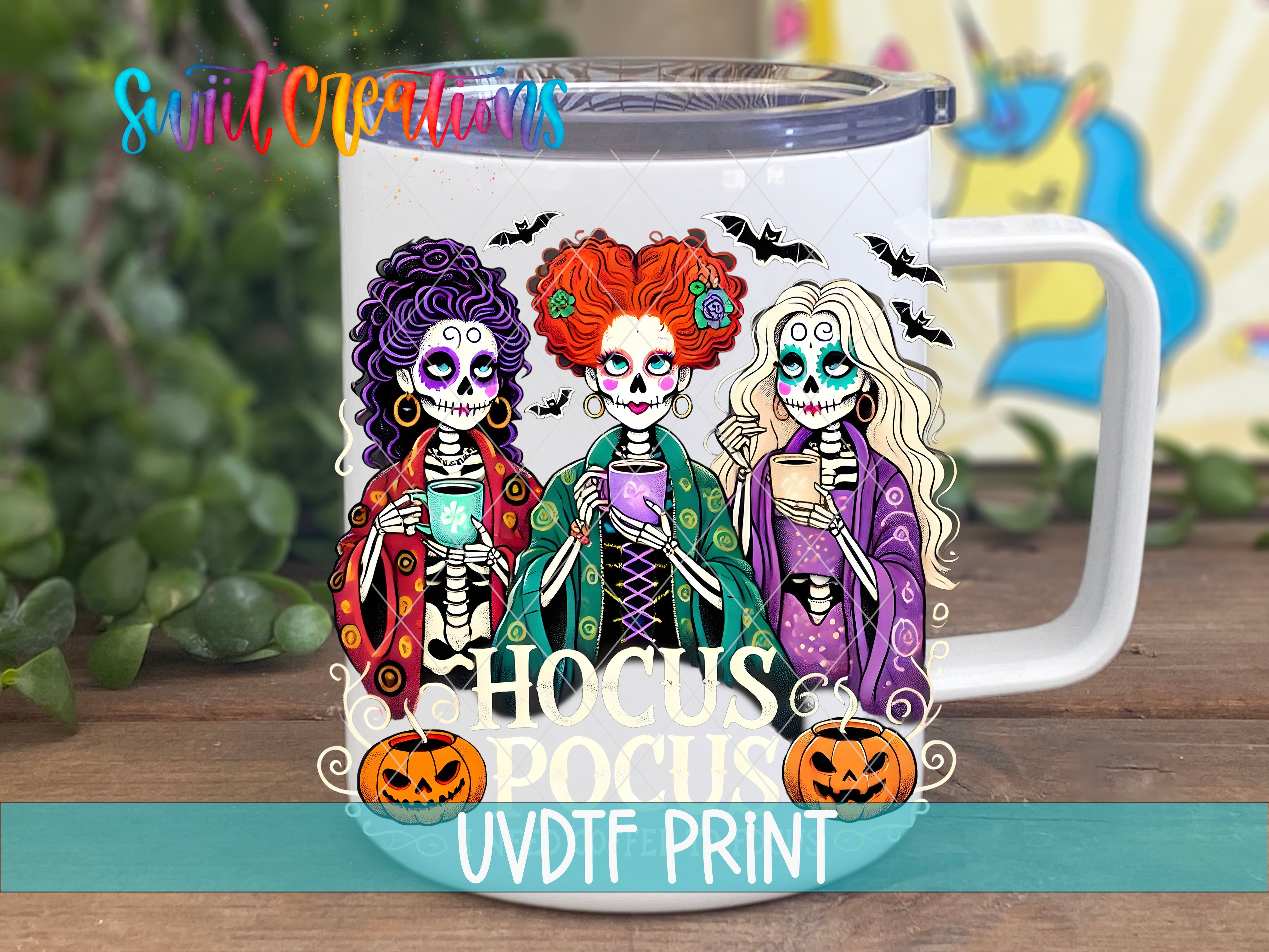 a white coffee mug with three skeletons on it