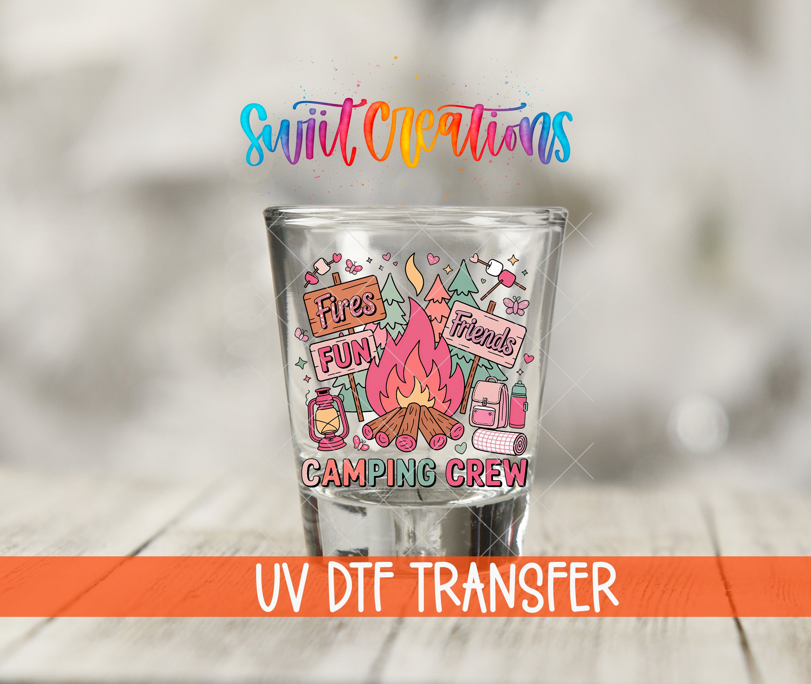 A shot glass with a colorful design featuring camping-related elements, such as a campfire, tent, and backpack, along with the text "Fires Fun Friends Camping Crew".